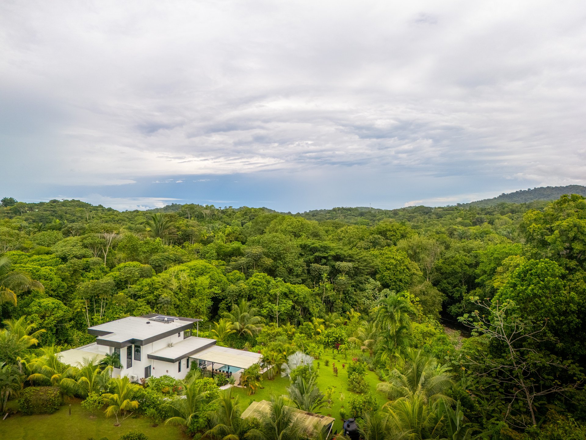Modern 4-Bedroom Family Sanctuary with Infinity Pool, Edible Forest Garden - Exclusive Gated Ojochal Community 