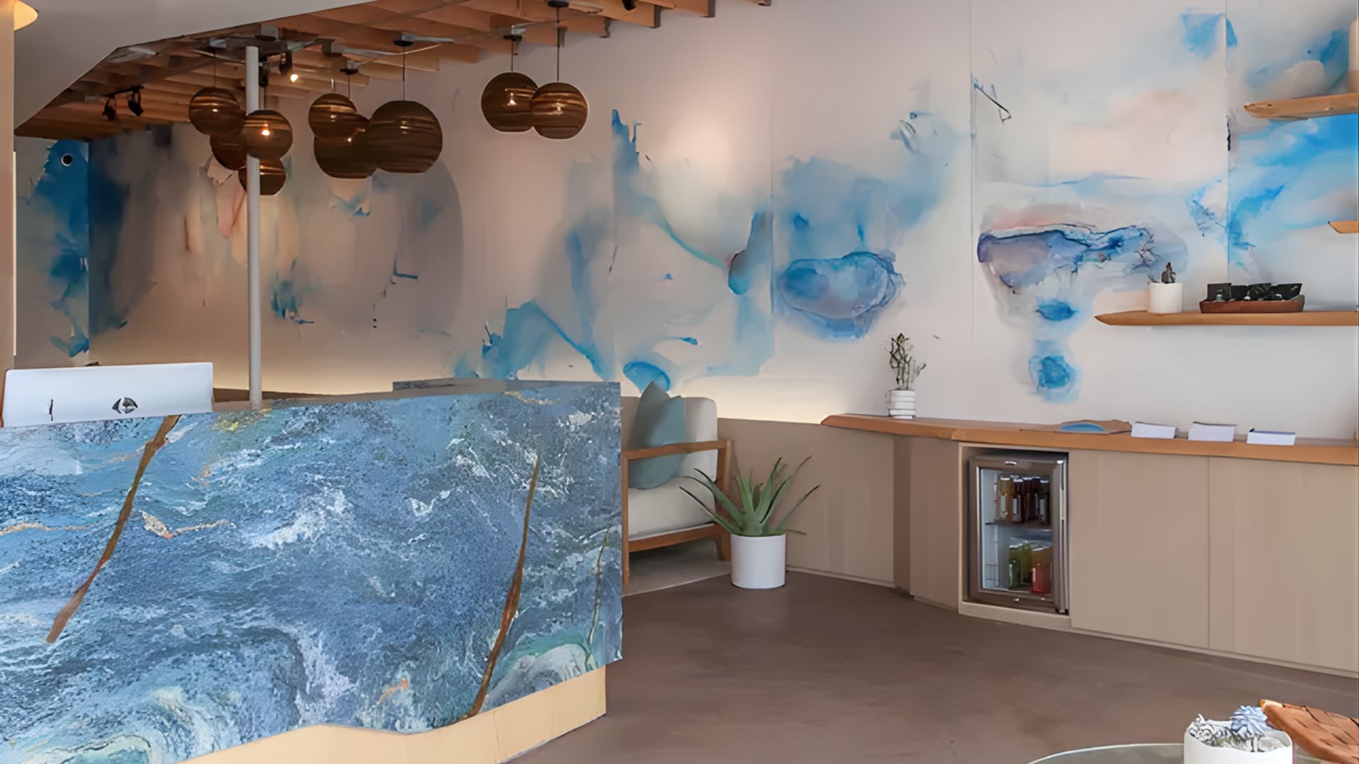 Miami wellness spa reception with blue watercolor wall art, wooden accents, and modern minimalist design - The Edit Real Estate wellness spots