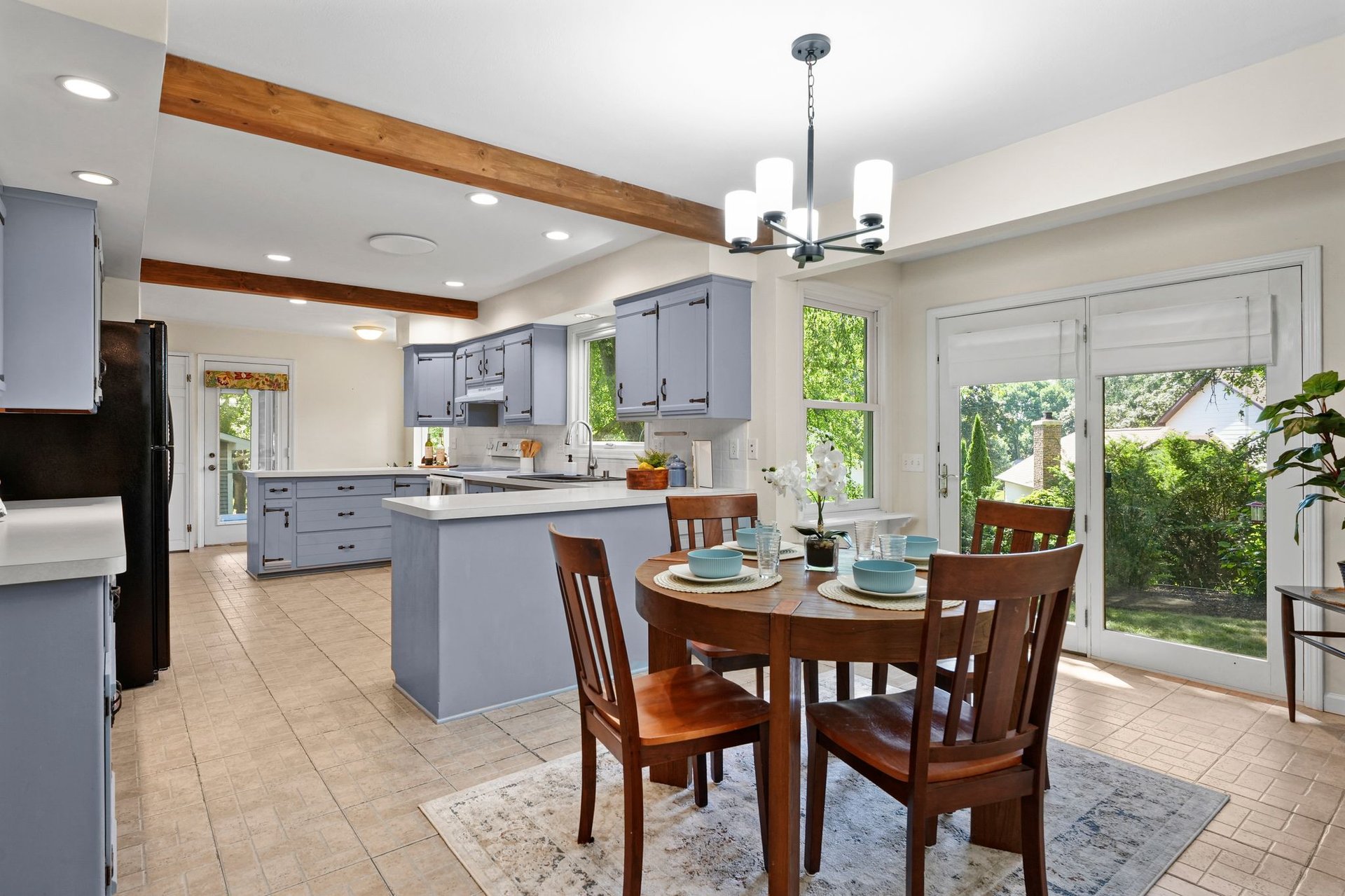 Open-concept kitchen flowing into the dining area at 10 Stonecrest Circle in Madison.