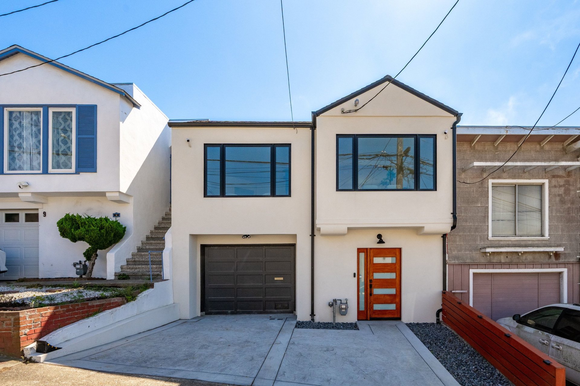 Front exterior and garage of 15 Shields Street, a remodeled home in Merced Heights, San Francisco