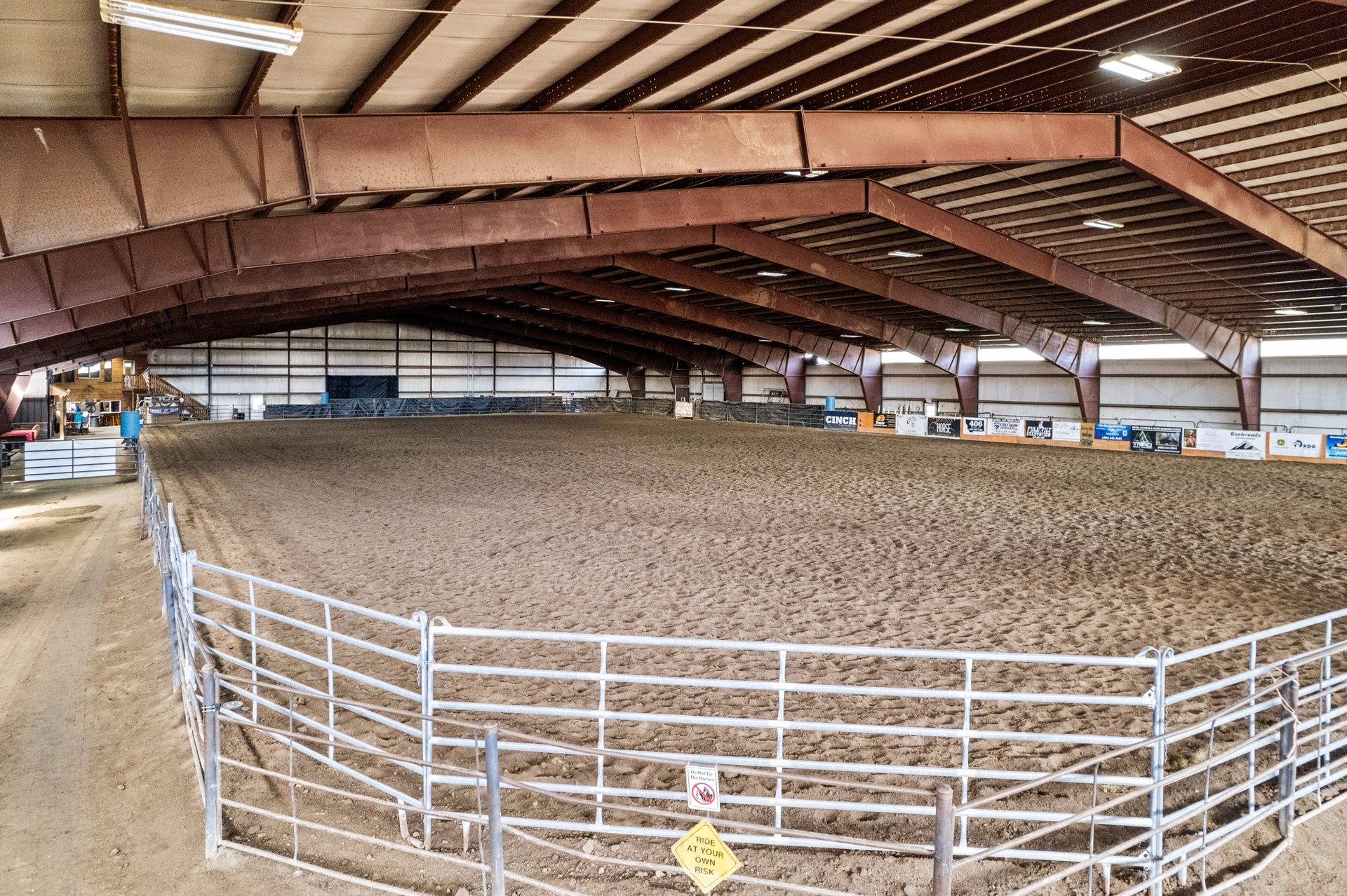 Interior wide view of the 300 foot indoor riding arena at 5C Arena & Event Center Montana