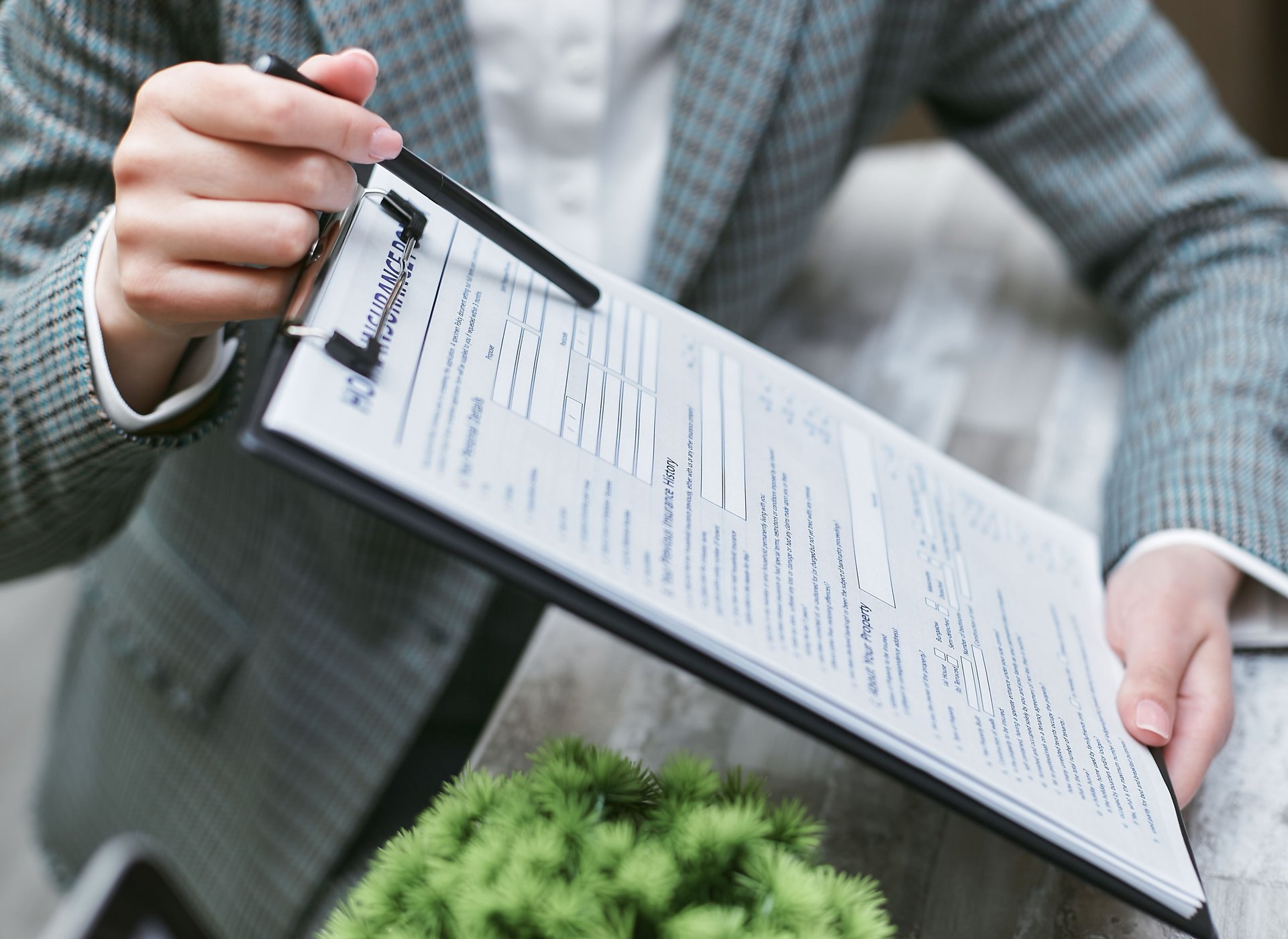 an insurance agent holding an insurance policy