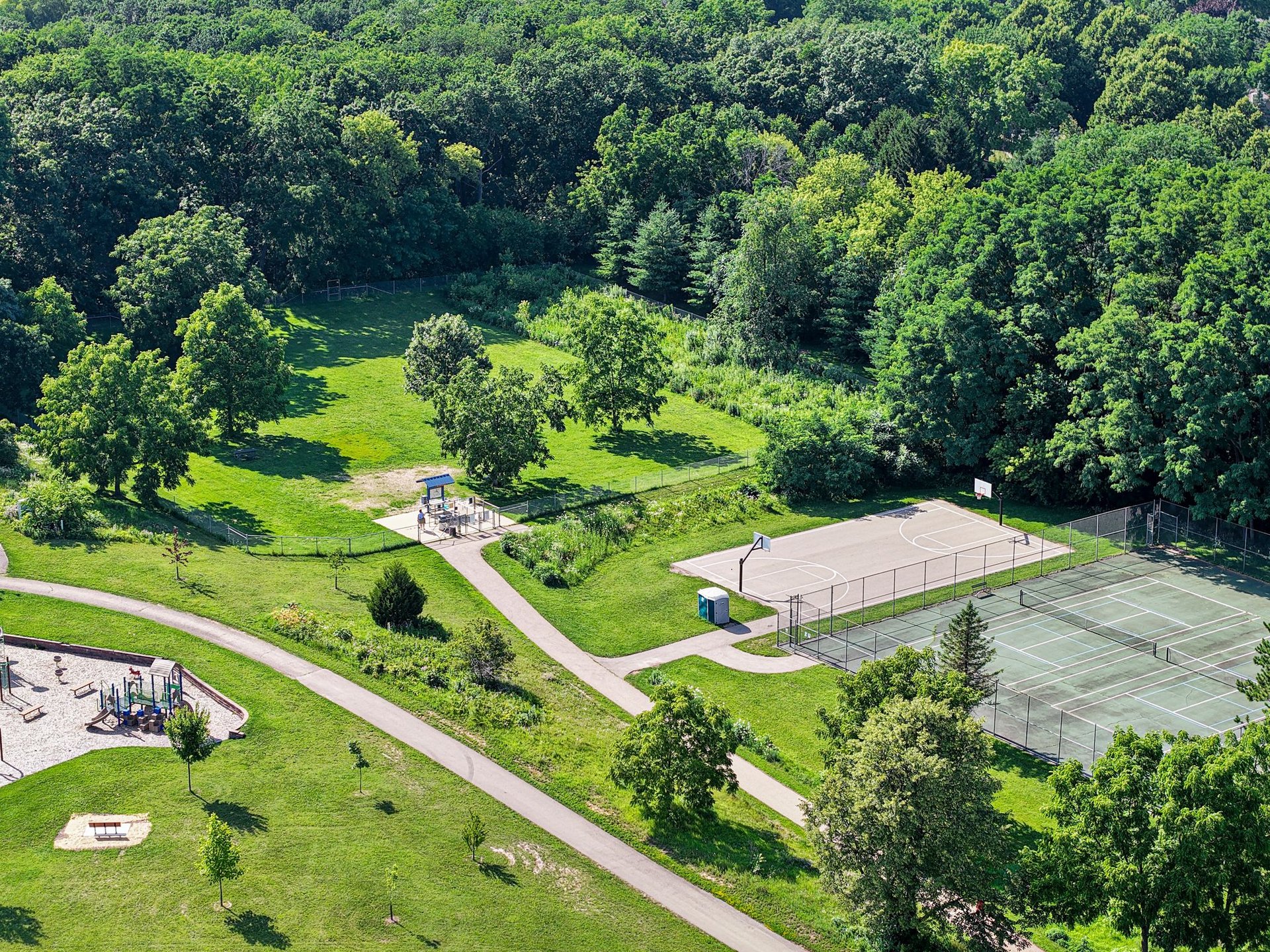 Aerial view of the Walnut Grove trail system, park, and green space behind 10 Stonecrest Circle in Madison.