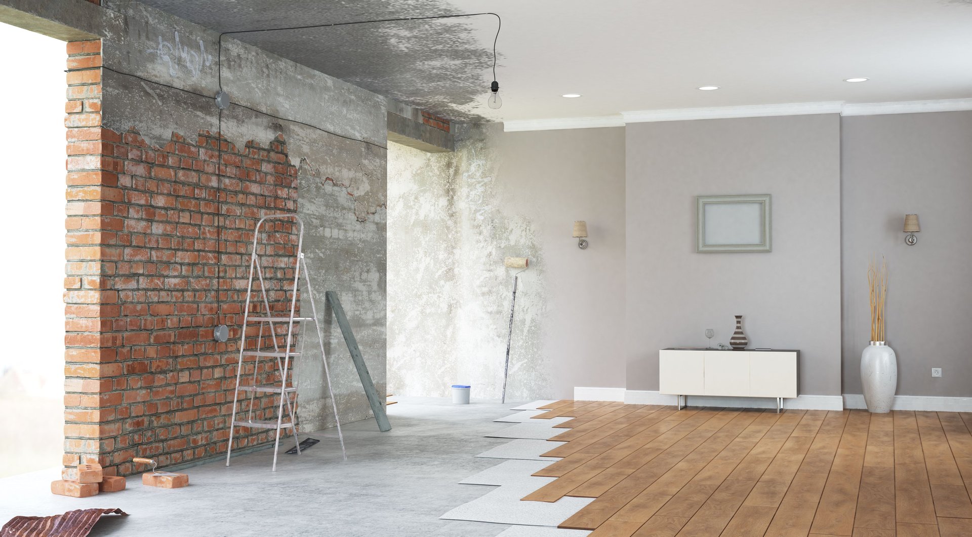 Living room under renovation, with exposed brick walls and new wood flooring being installed.