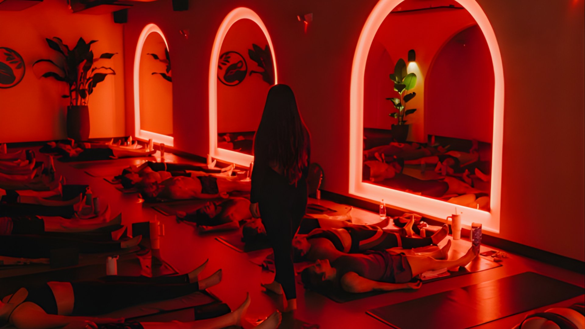 Red light therapy wellness studio with neon arched mirrors and infrared treatment space - The Edit Real Estate Miami wellness spots