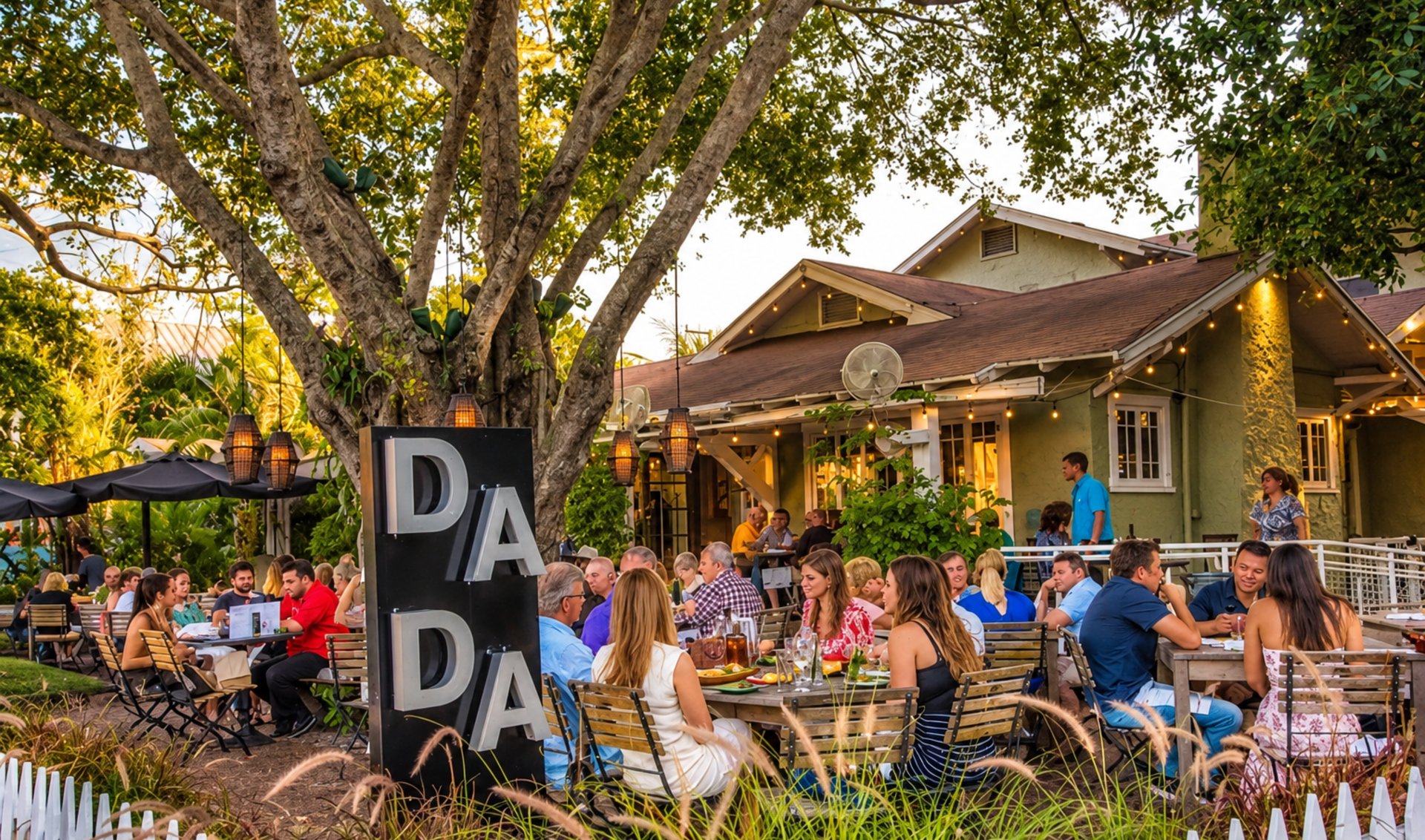 Dada restaurant’s crowded outdoor patio beneath a large shade tree.