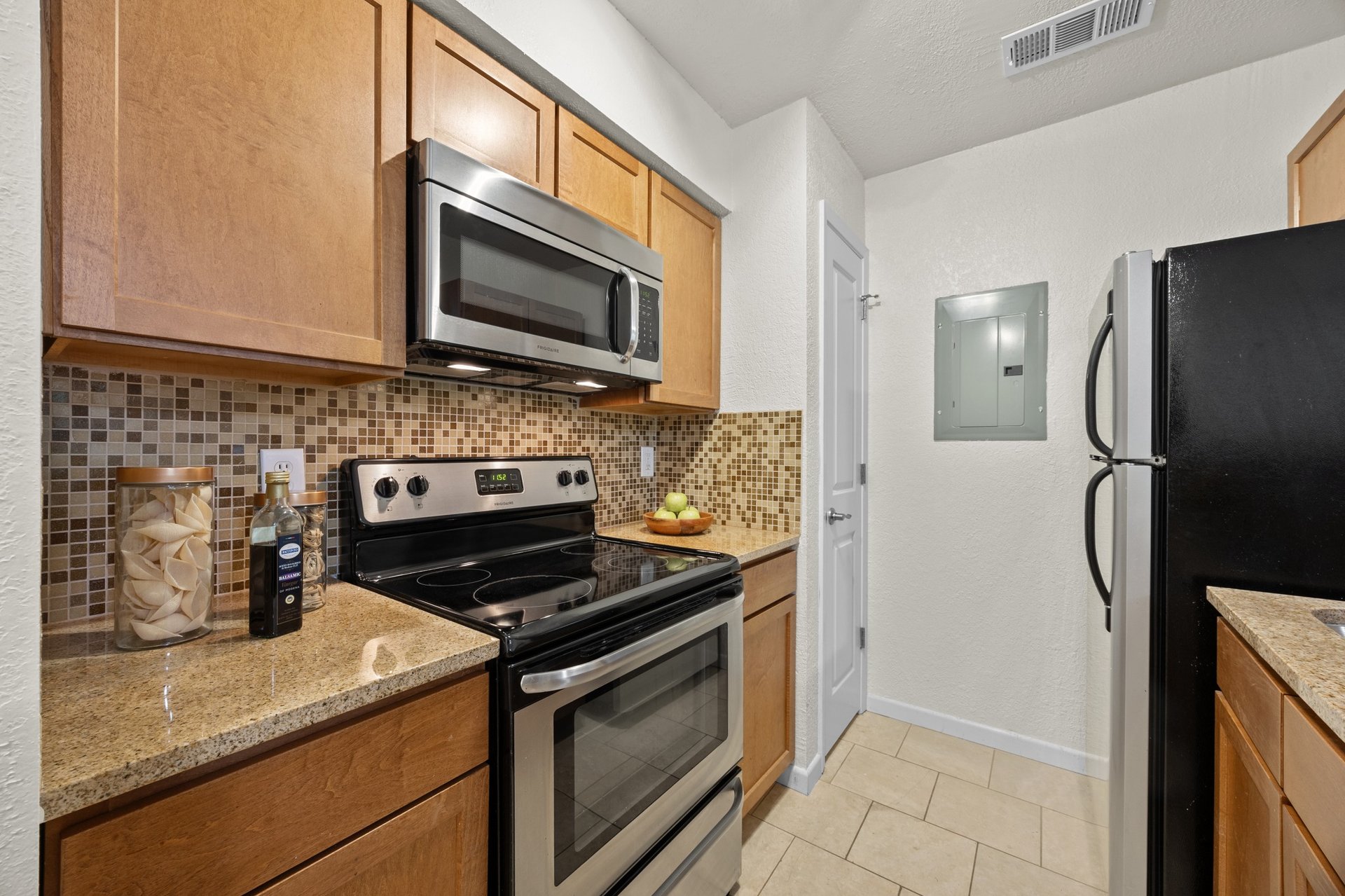 Top-Floor Condo Retreat in Gated Ivy Condos | Private Balcony + Tree-Filled Views