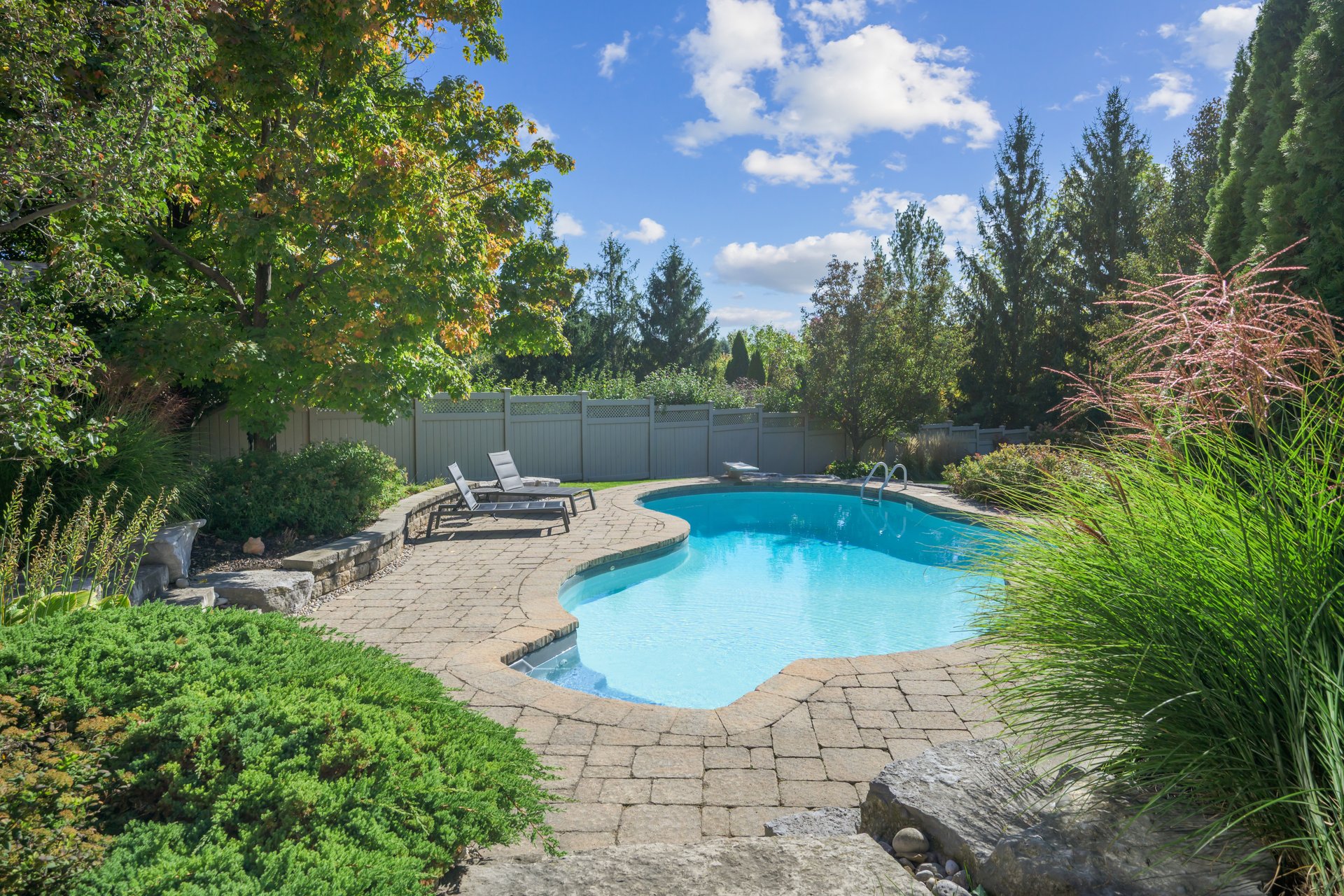 Resort-style yard backing onto lush ravine