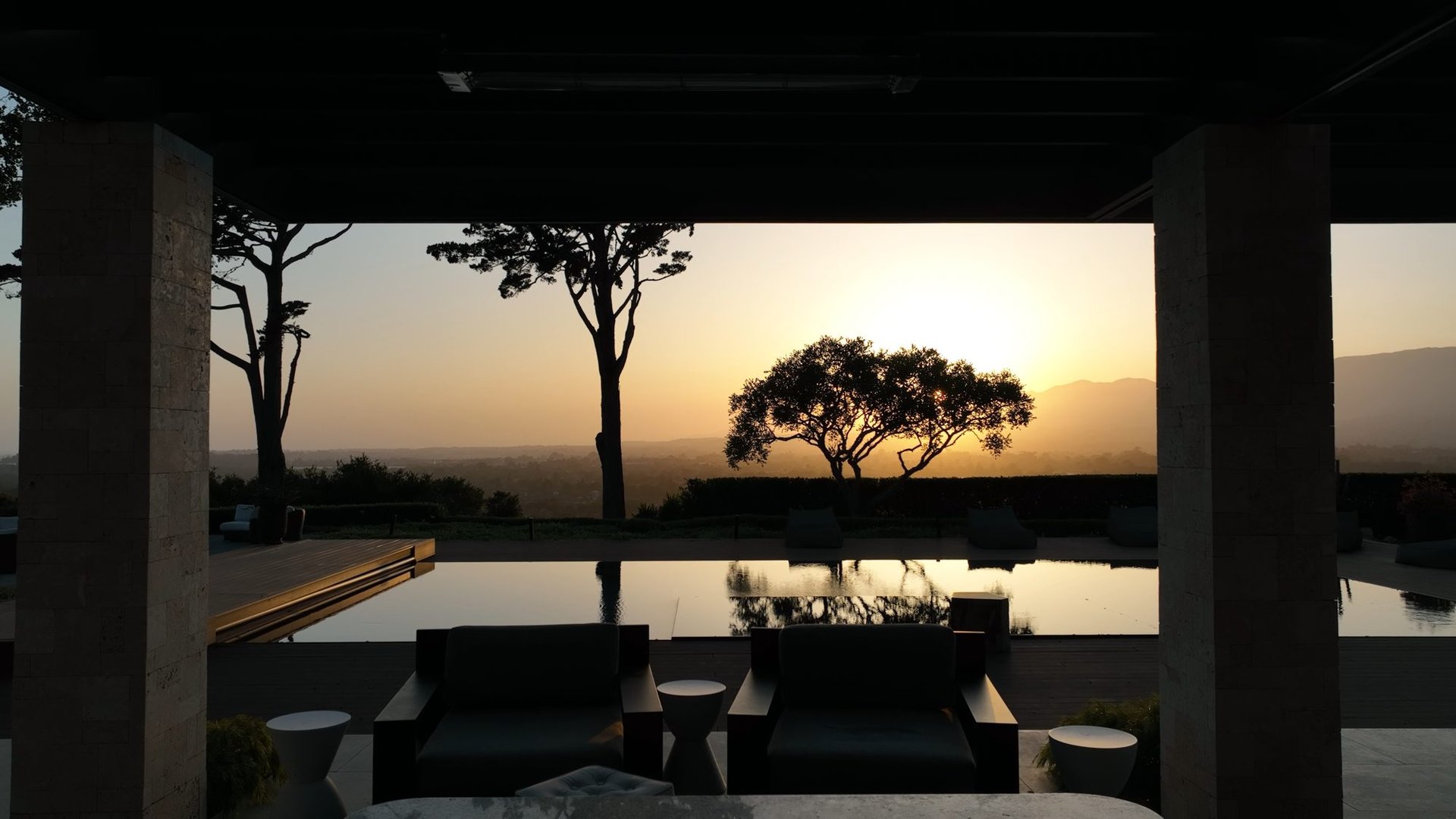 A Santa Barbara home with a pool and sunset views over the mountains