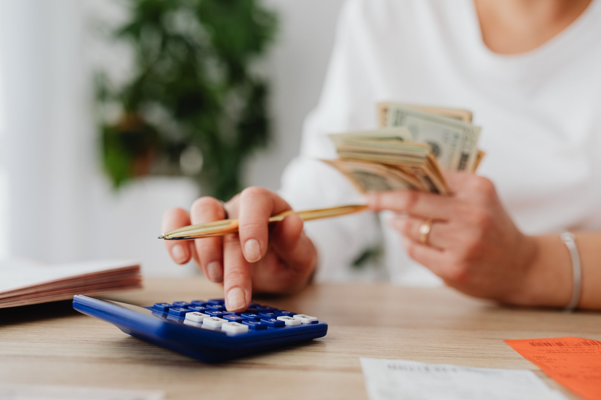a person using a blue calculator