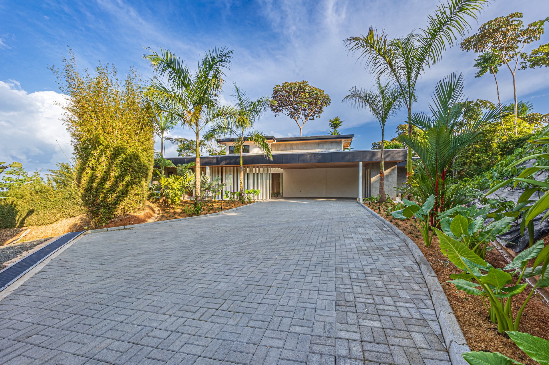 New contemporary tropical villa boasts with a movie theater and views of the iconic whale’s tail