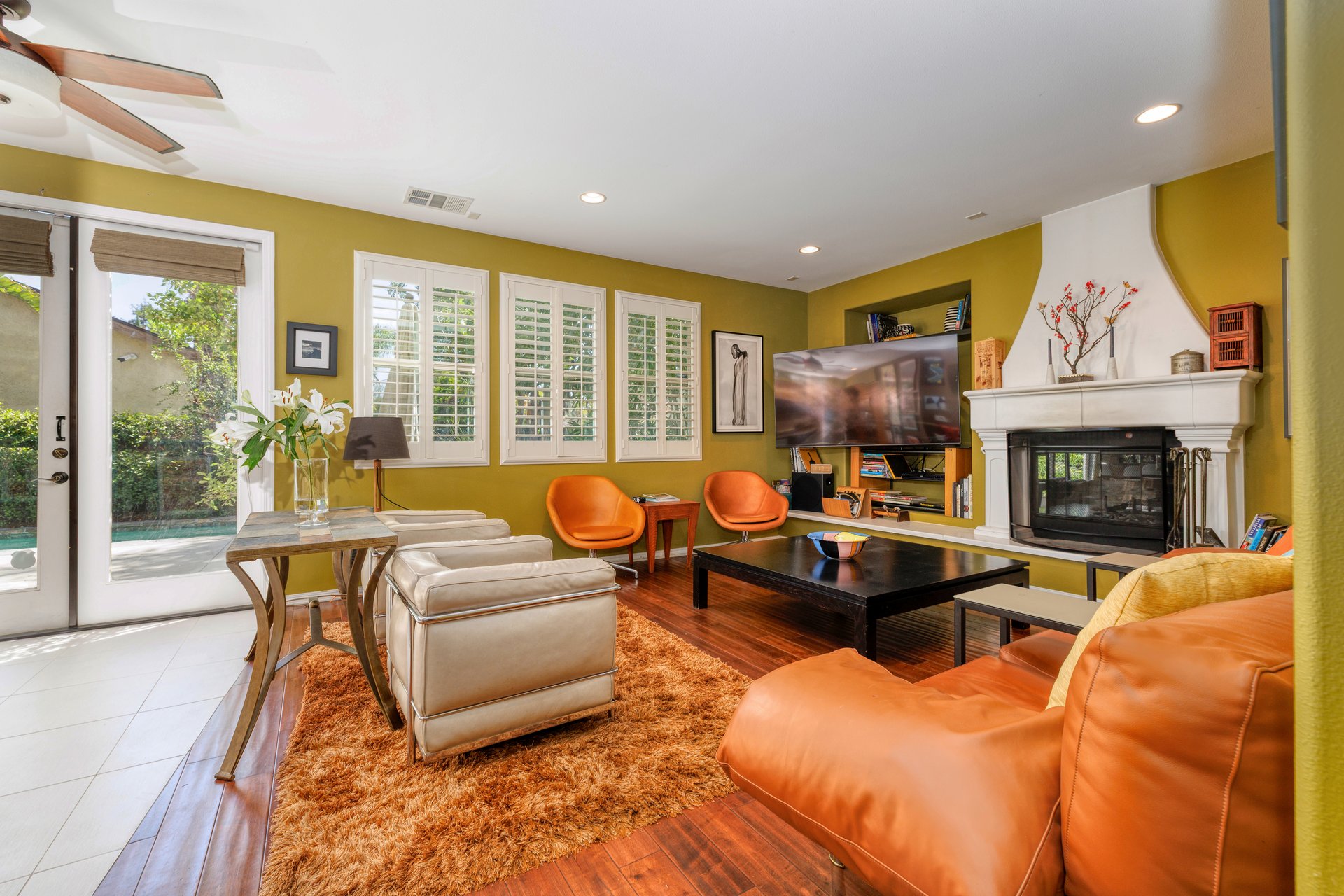 Living room with vaulted ceilings, fireplace, and family room seating