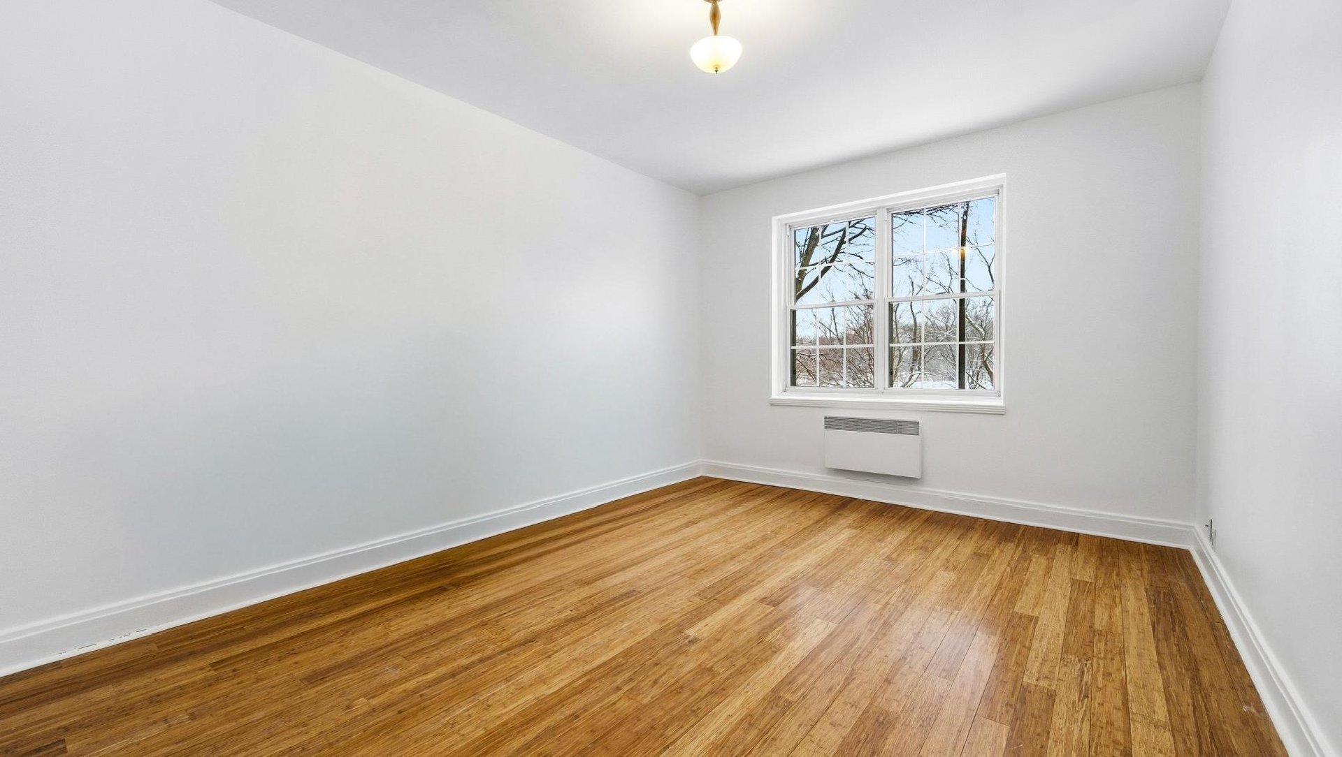 At the edge of Westmount | Corner unit with a view of Mount Royal