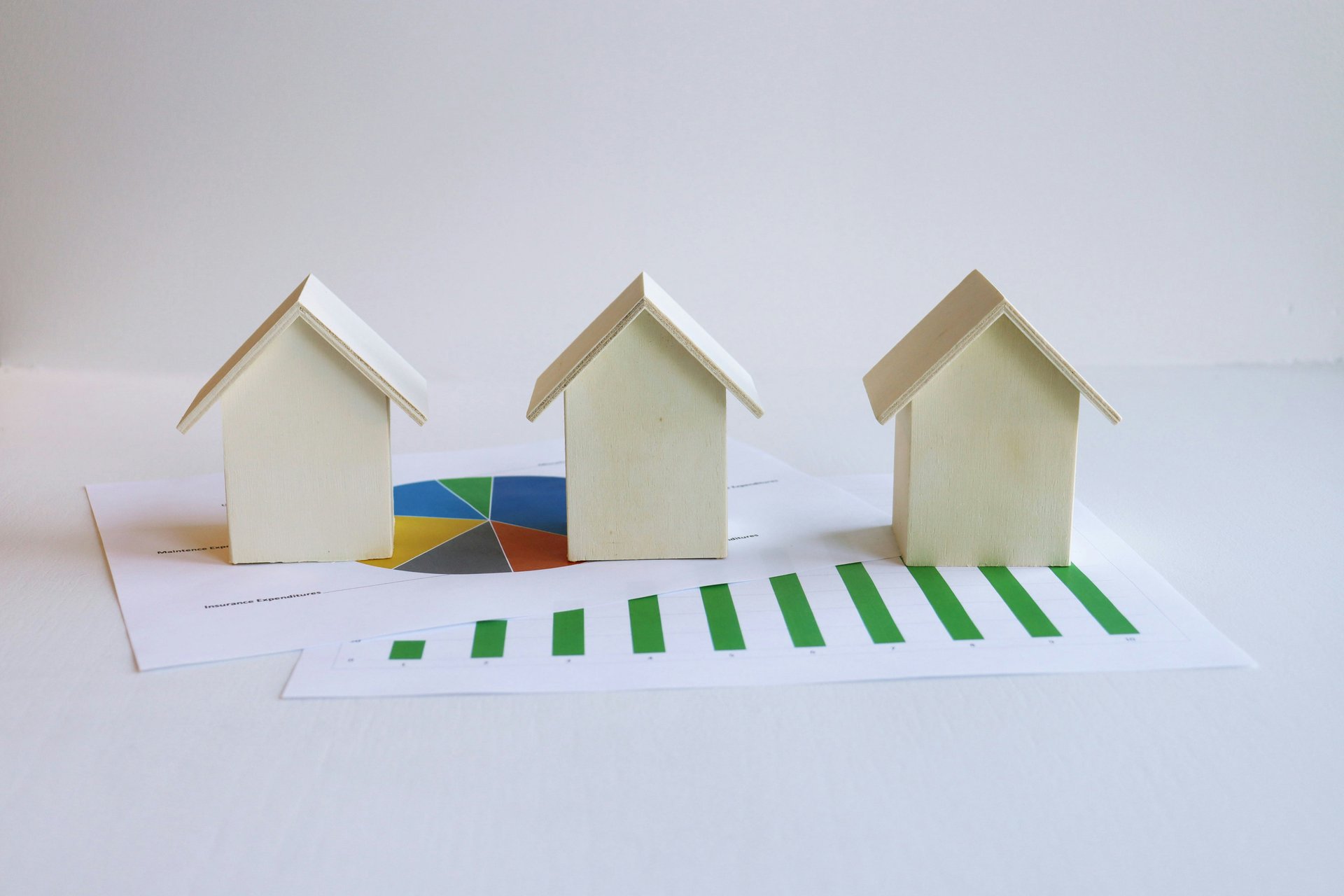 House models and property documents representing real estate records