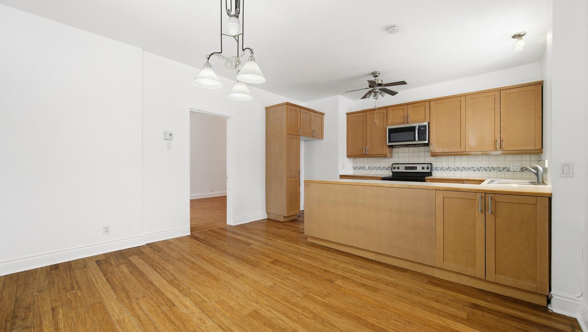 At the edge of Westmount | Corner unit with a view of Mount Royal