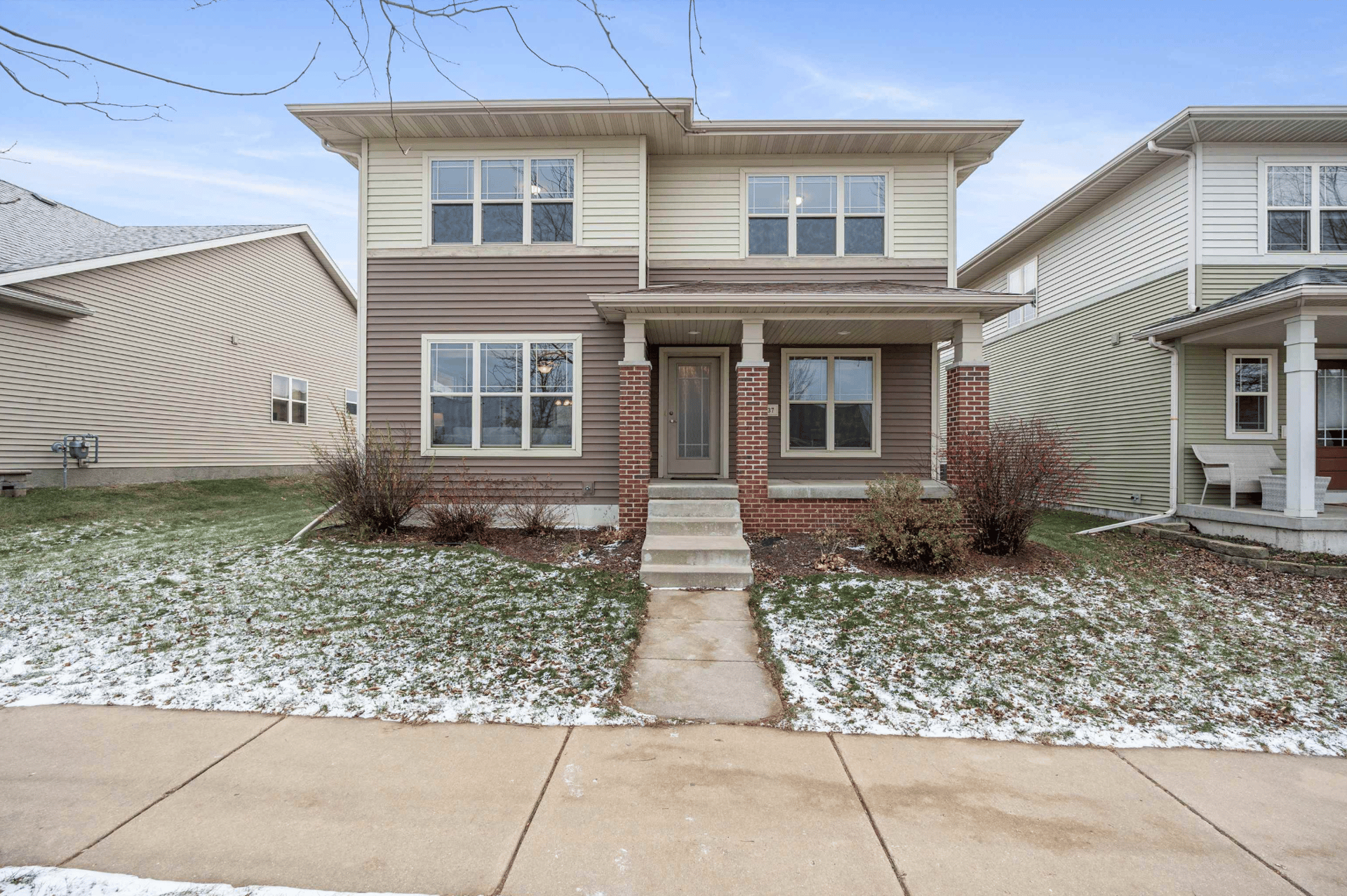 Exterior view of a classic two-story suburban home in Verona, WI, representing the highly desirable and competitive mid-tier real estate market that buyers are targeting in this price bracket.