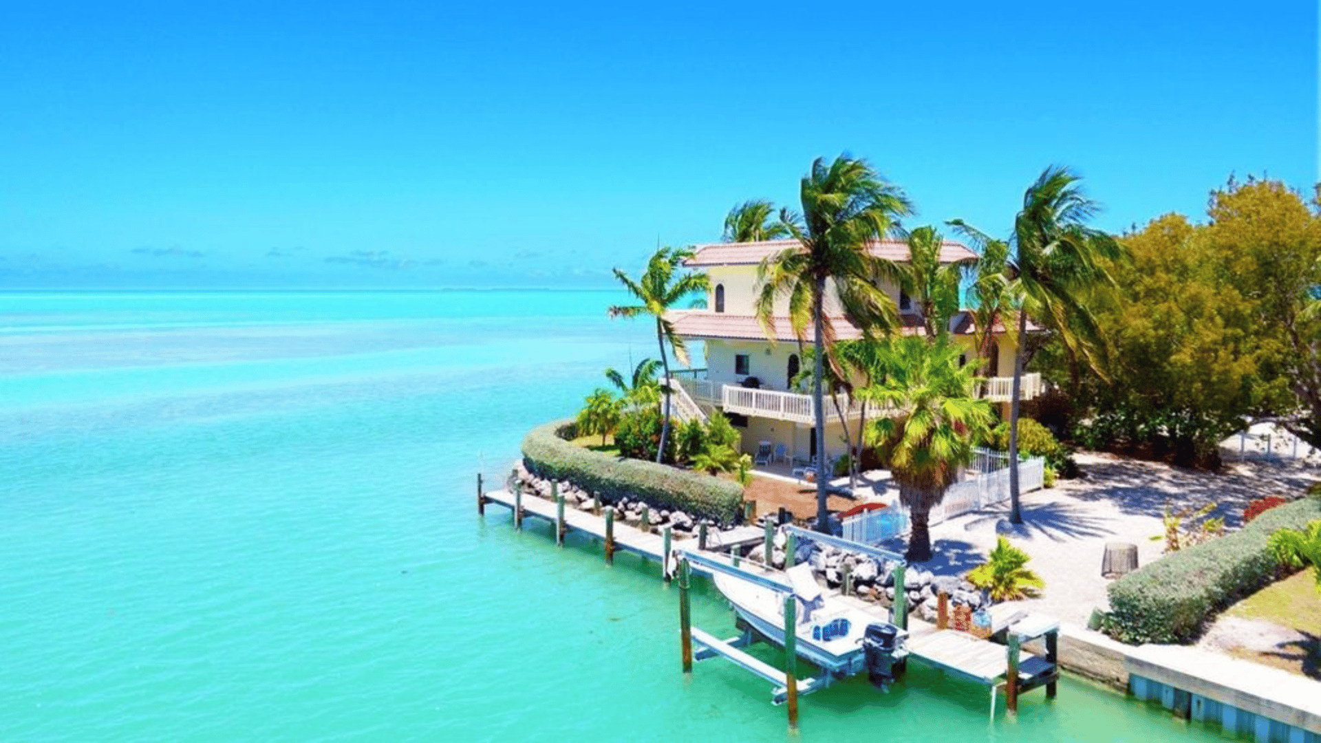 Islamorada Florida Keys waterfront paradise with turquoise waters and boat dock - The Edit Real Estate October travel guide