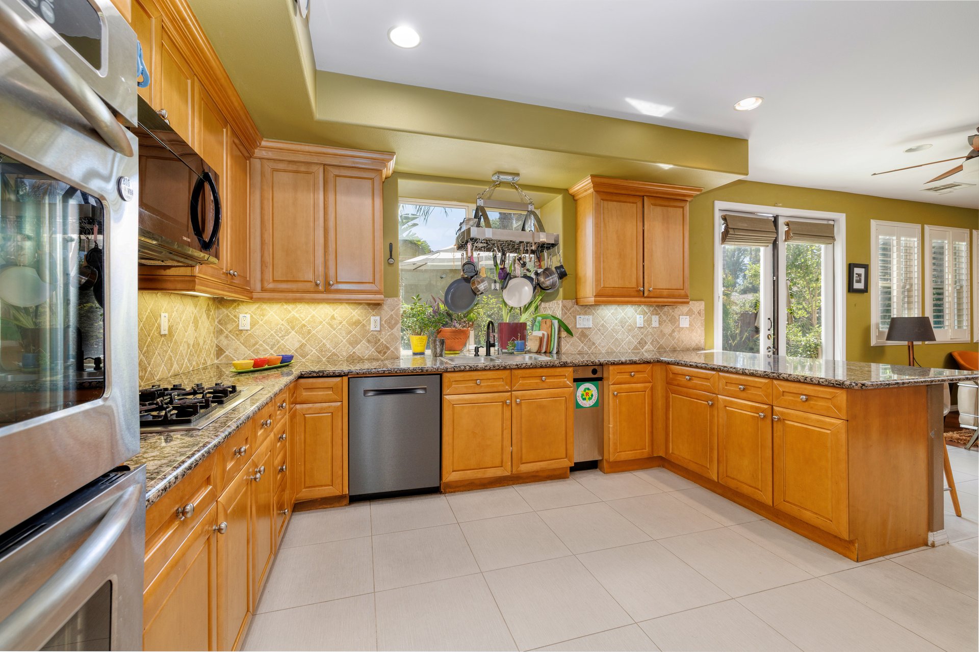 Kitchen with granite countertops and wood cabinetry