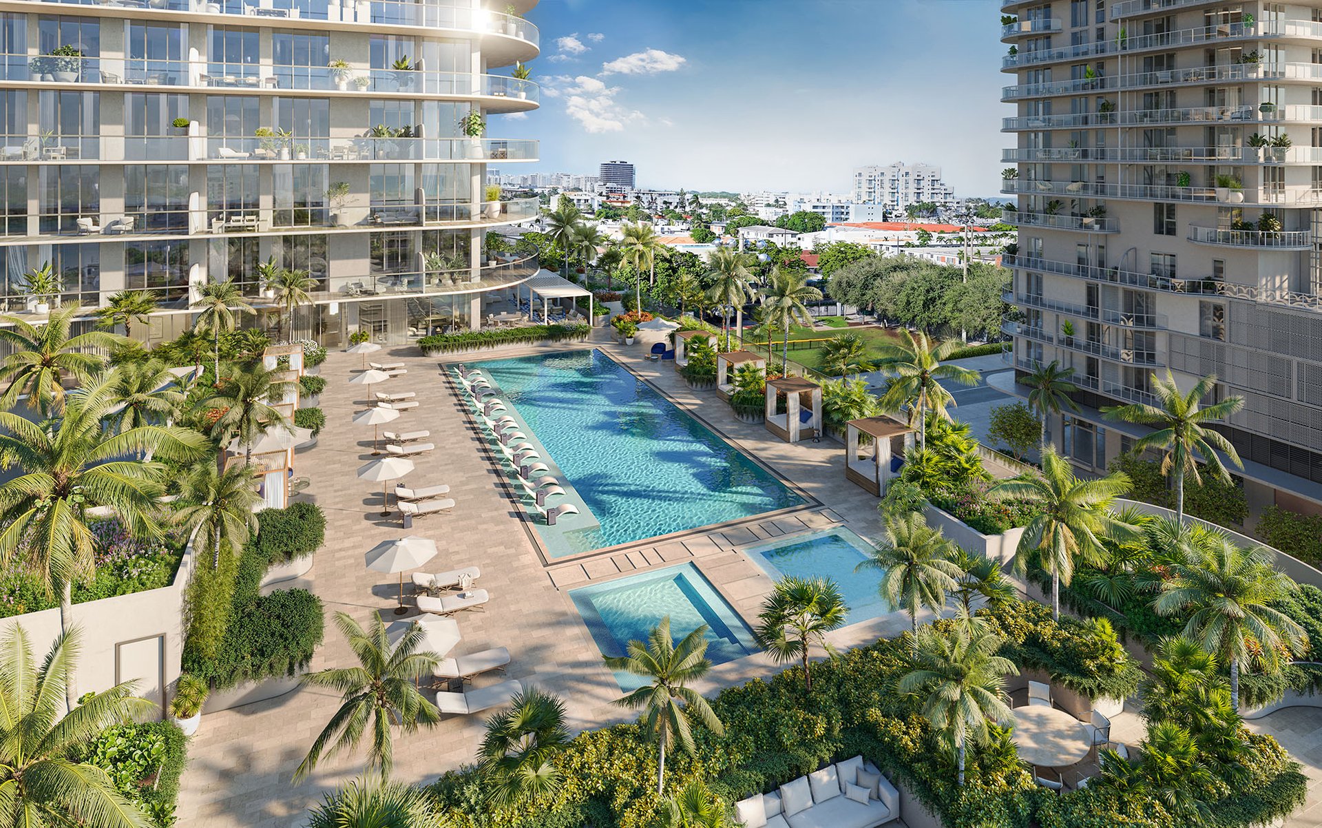 72 Carlyle residences frame a landscaped pool deck with cabanas, lounge chairs, and palm trees.