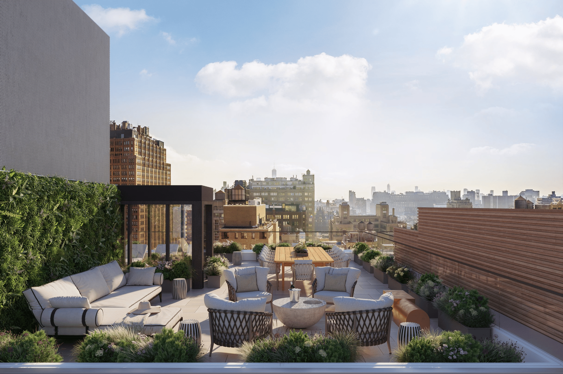 Rooftop terrace with outdoor lounge seating and dining area overlooking the city skyline.
