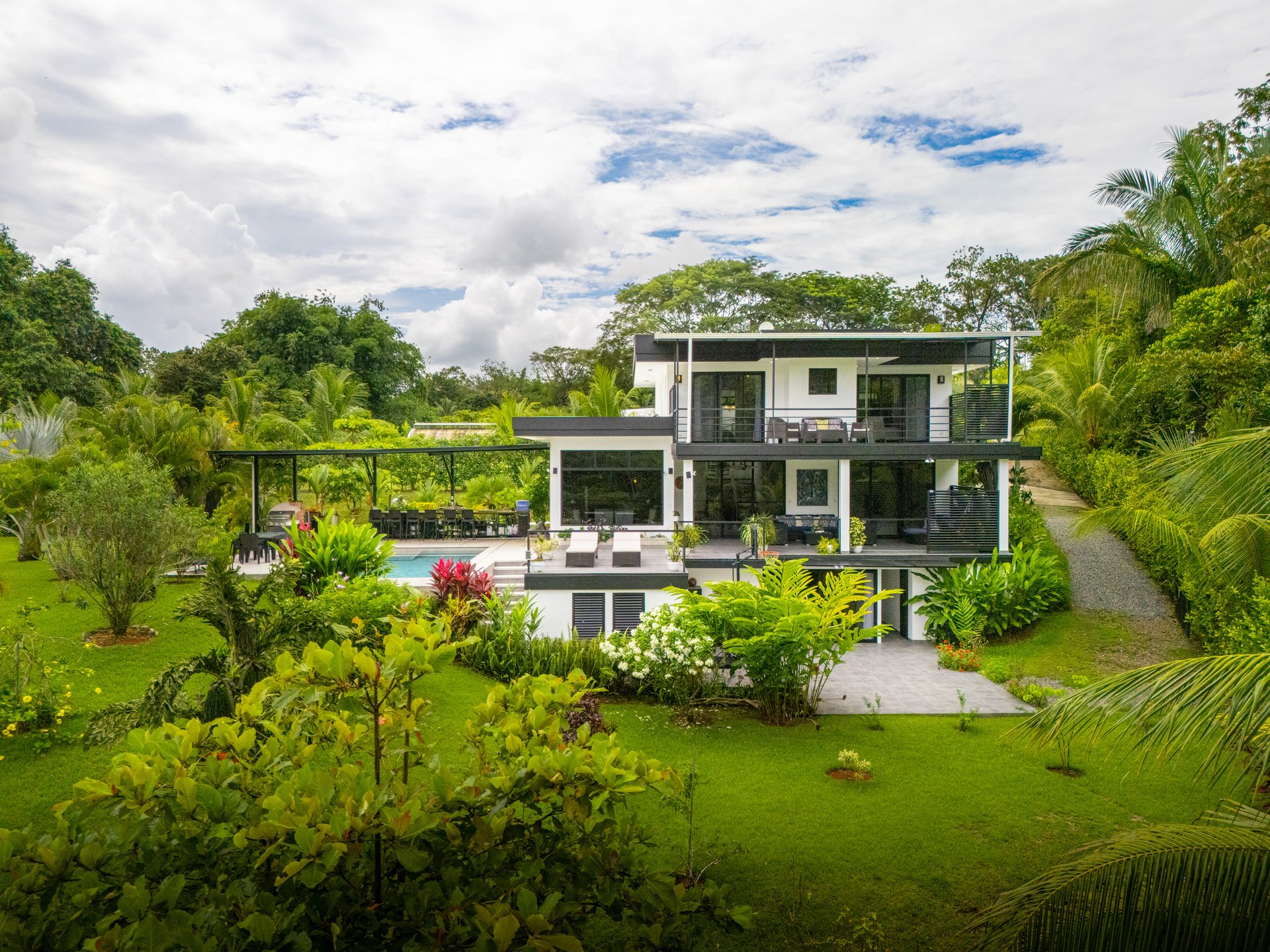 Modern 4-Bedroom Family Sanctuary with Infinity Pool, Edible Forest Garden - Exclusive Gated Ojochal Community 