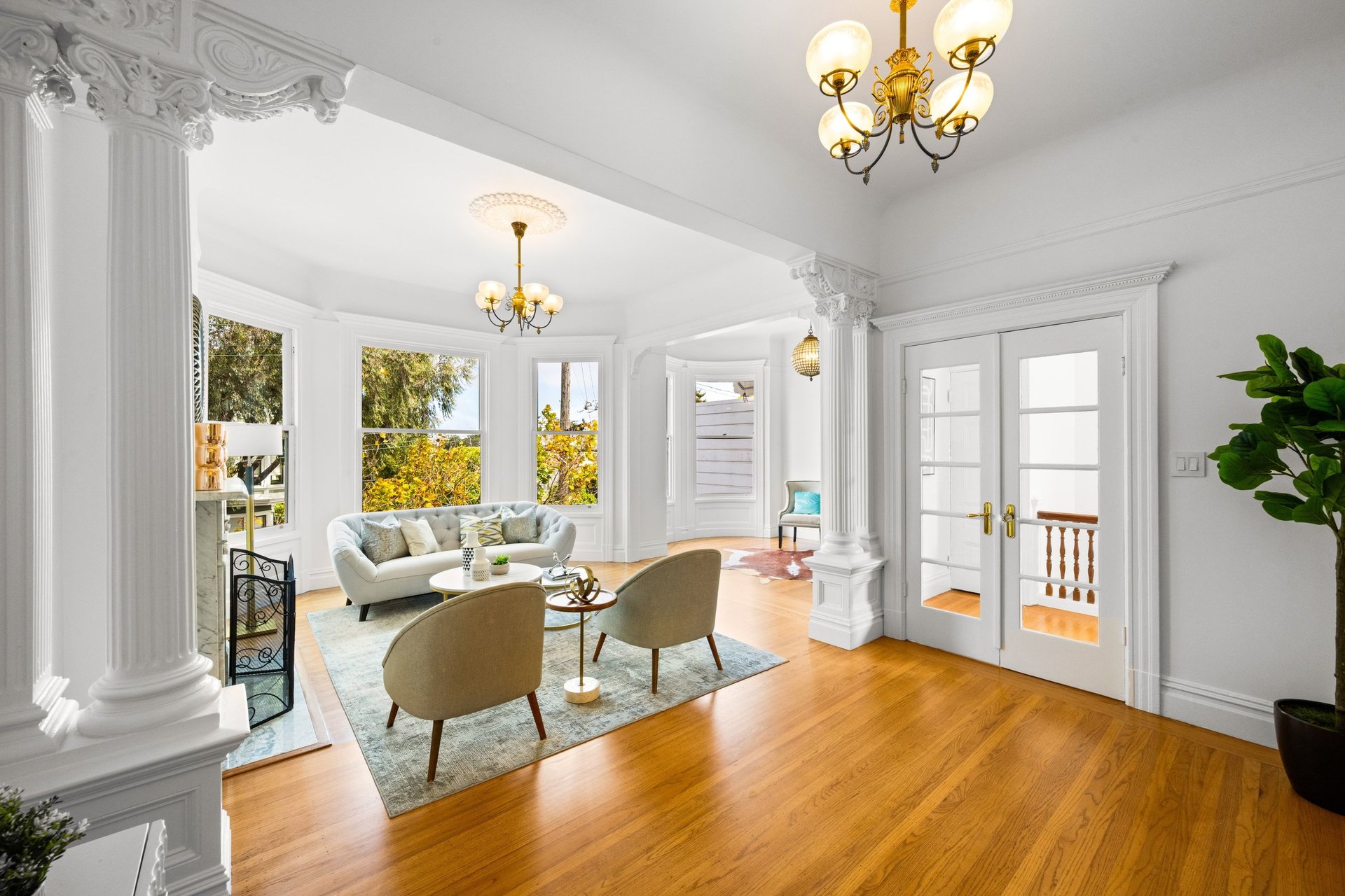 Double parlor with columns and French doors at 449 Frederick Street, a Victorian TIC in Cole Valley, San Francisco