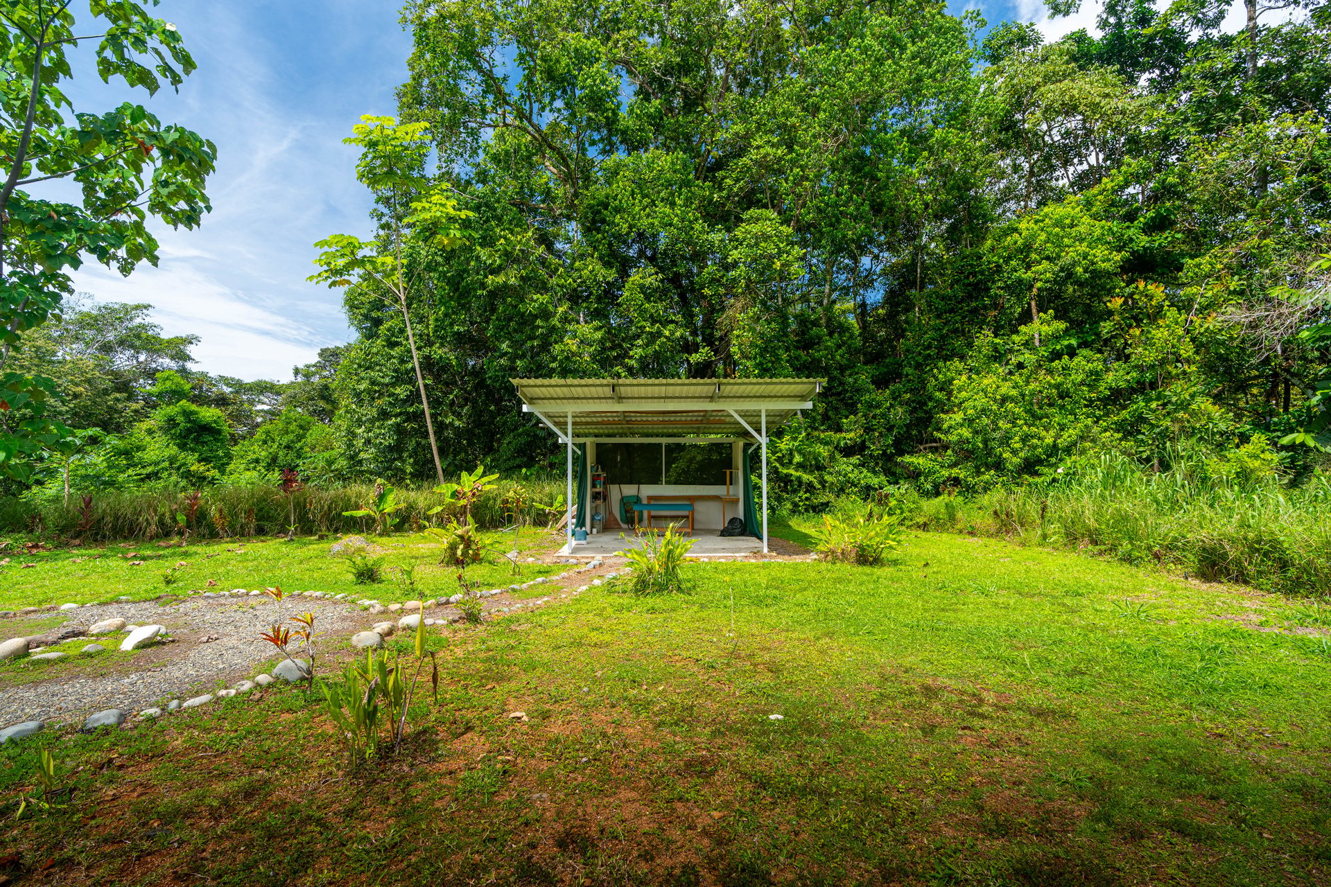 Plant Your Roots at Tierra Bendita! 2.5 Acres, River Frontage, 2 Bedroom Home, Private, Easy Access!