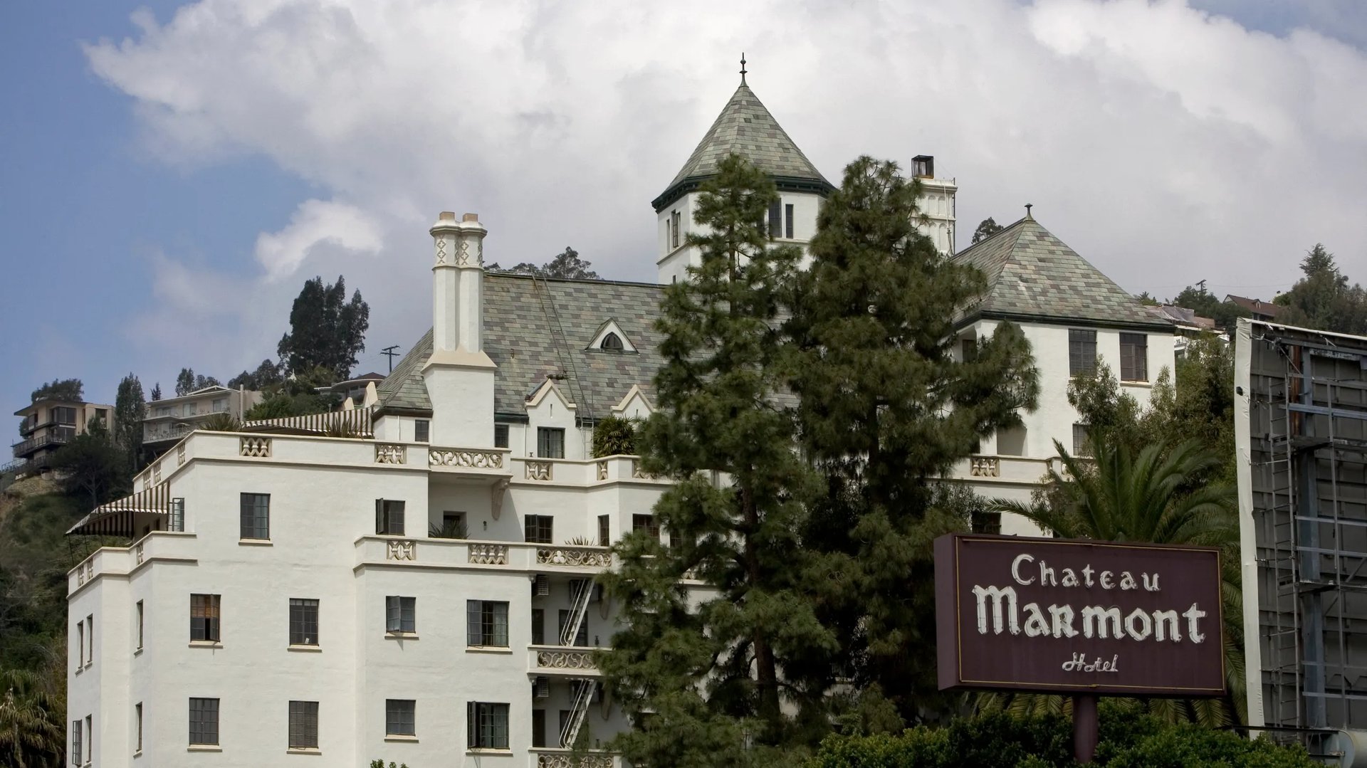 Here is your SEO-optimized alt image text for the Chateau Marmont photo with the requested context:  ⸻  Alt Image Text (SEO Optimized): The historic Chateau Marmont in West Hollywood, where Lindsay Lohan resided with global luxury real estate advisor Brendan Brown—who would later marry at the same location with Lohan’s younger brother Dakota serving as ring bearer.