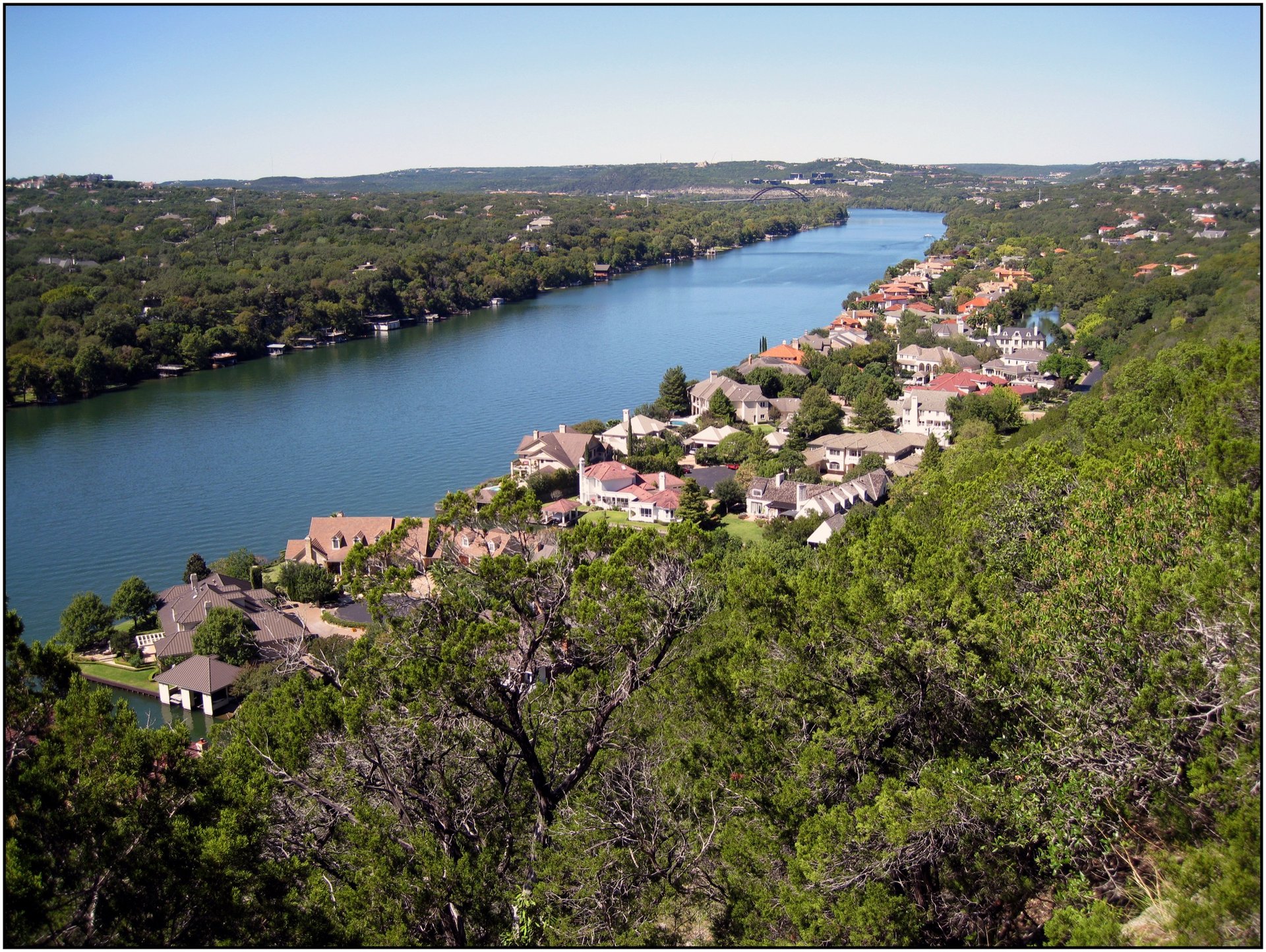 Lake Austin seen from Mount Bonnell, waterfront homes lining both banks.