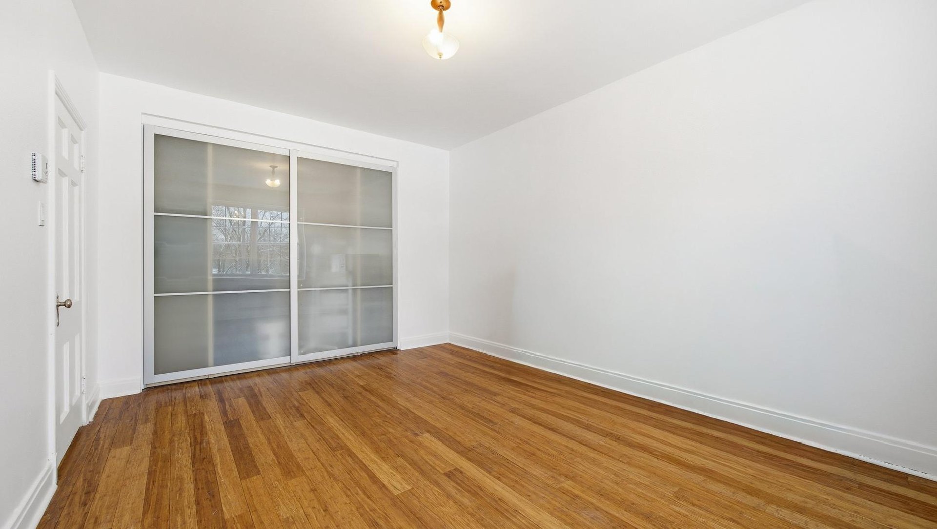 At the edge of Westmount | Corner unit with a view of Mount Royal