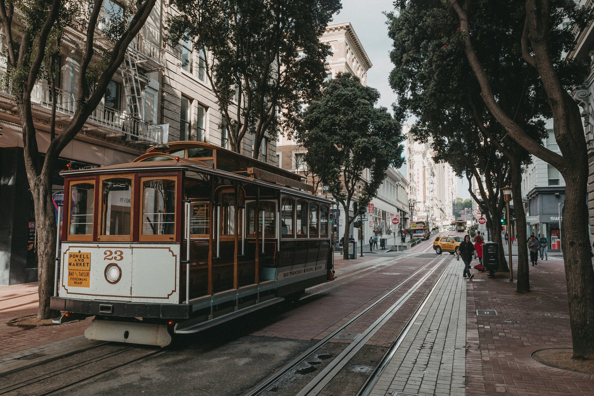 San Francisco cable car on Powell Street with historic buildings
