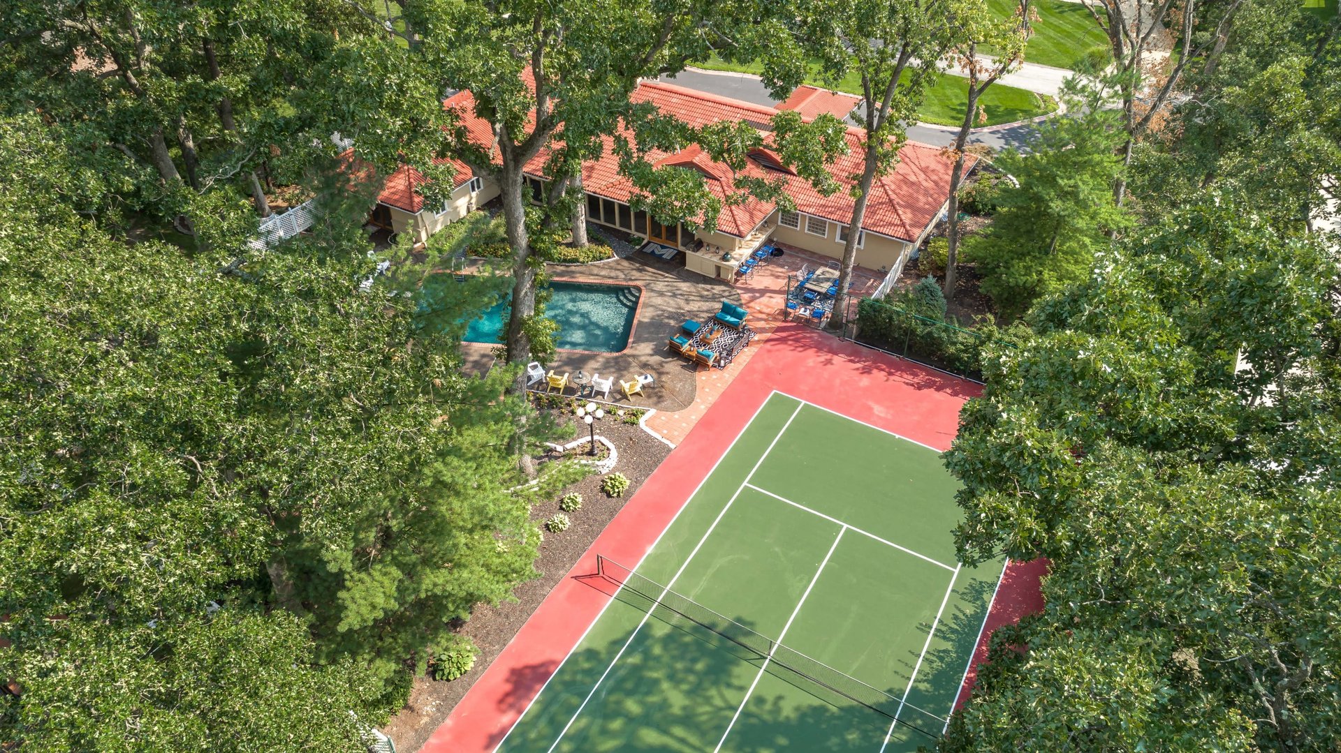 A Special Retreat on a Prized One Acre Lot With Pool and Tennis Court