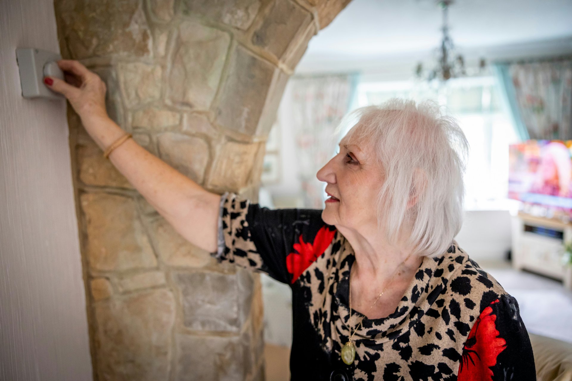 Older adult using a home fixture as part of an accessible living space