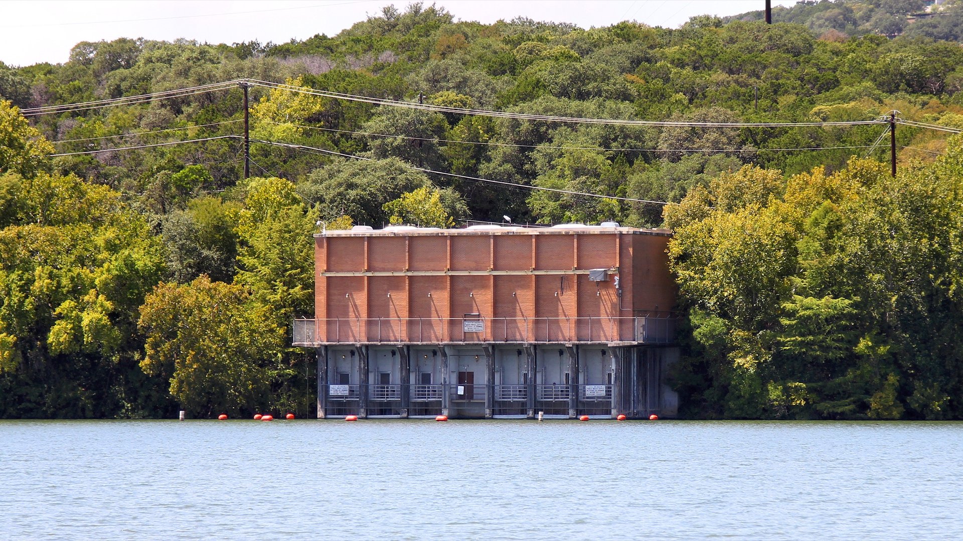 A water intake structure on the bank of Lake Austin.