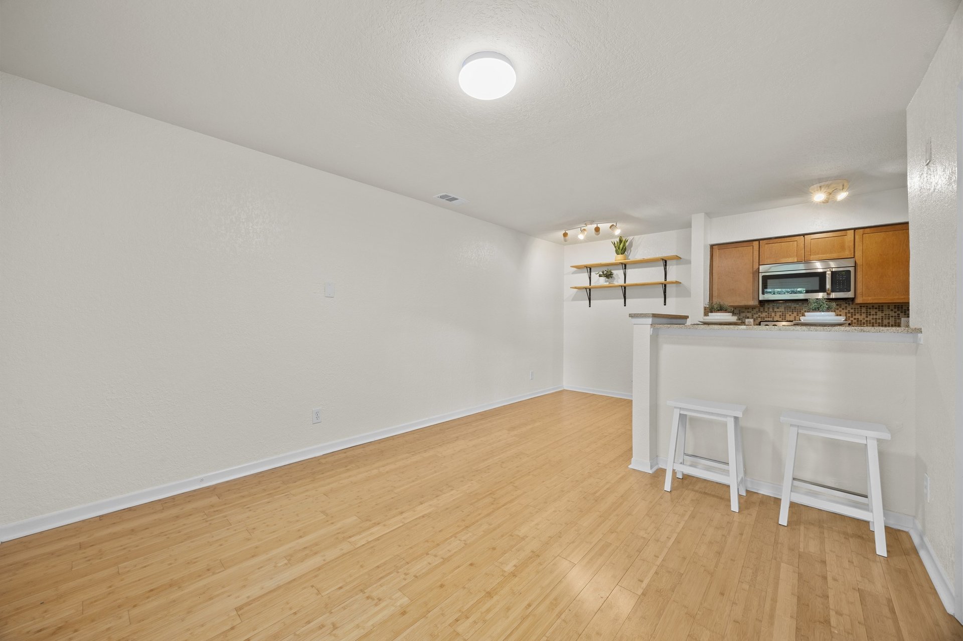Top-Floor Condo Retreat in Gated Ivy Condos | Private Balcony + Tree-Filled Views
