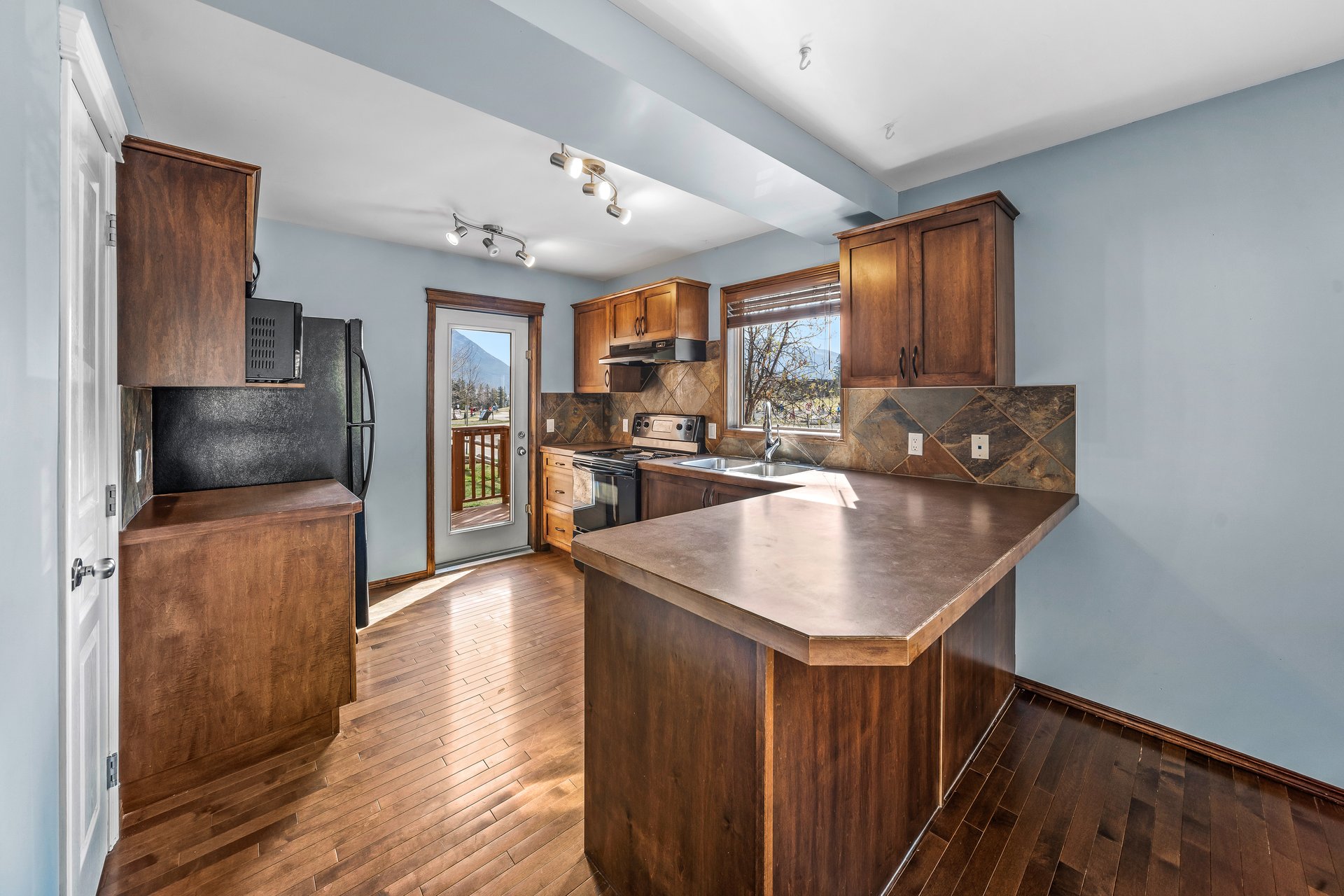 Detached Home in Three Sisters | Bareland Condo