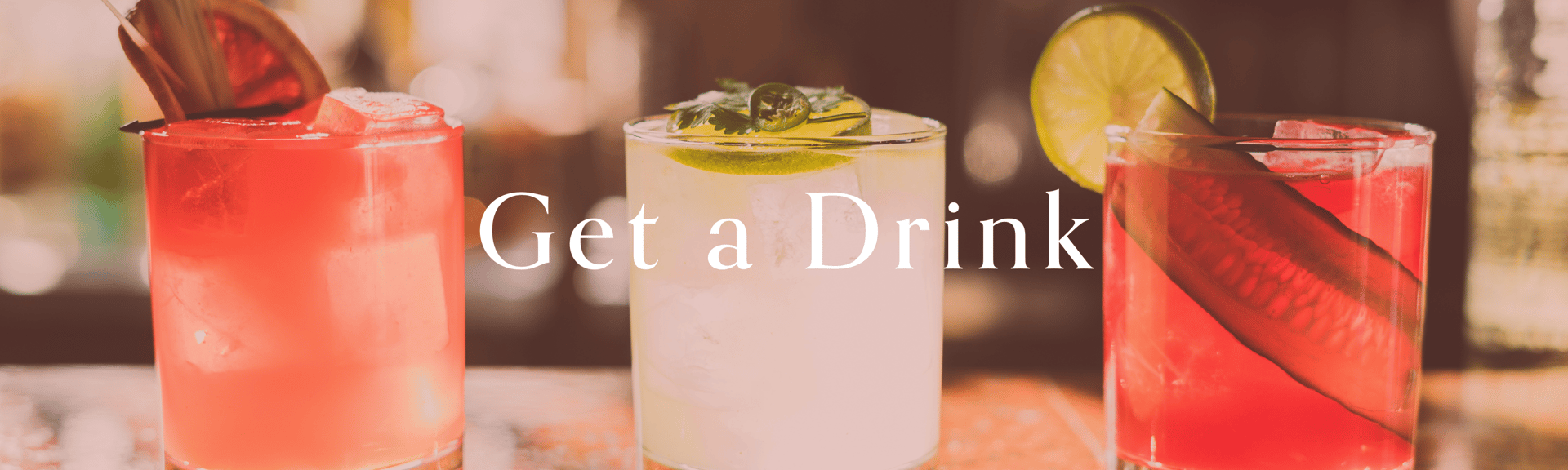 Three colorful cocktails with garnishes, featuring a bold "Get a Drink" text overlay.