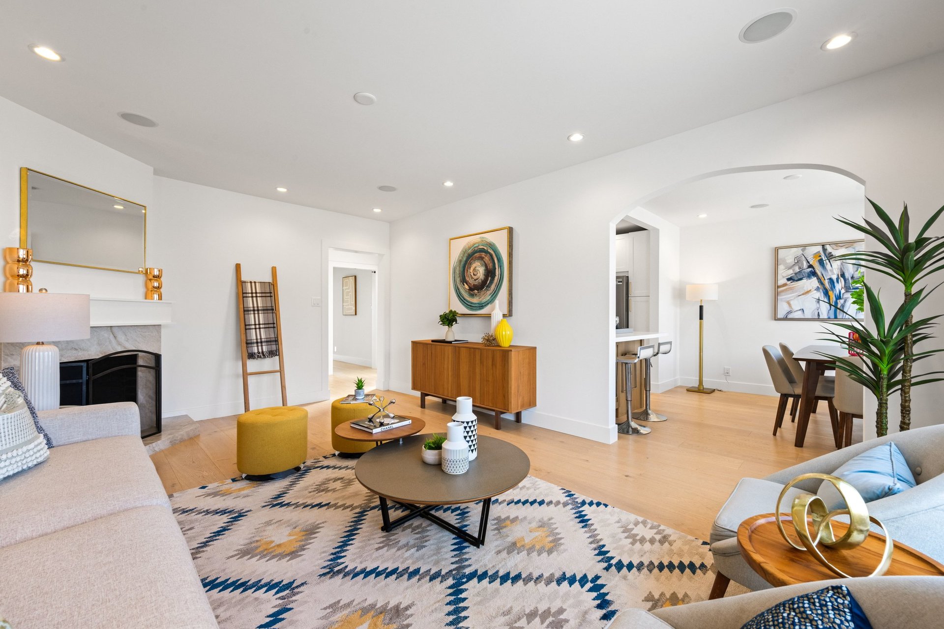 Living room with fireplace opening to the dining room through an arch at 15 Shields Street