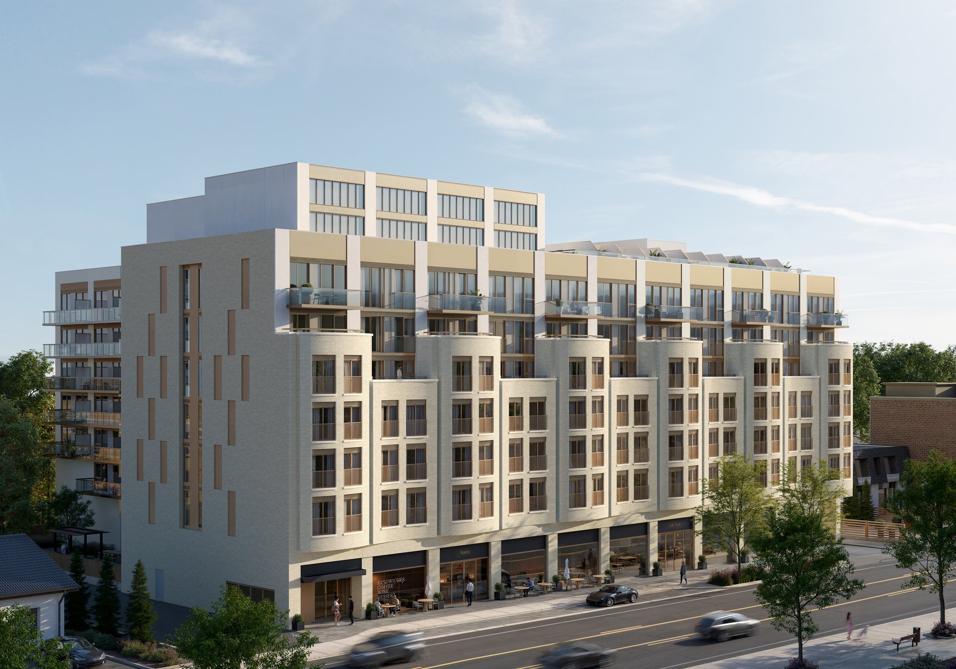 Claystone Condos, a multi-story residence with glass balconies and street-level shops.