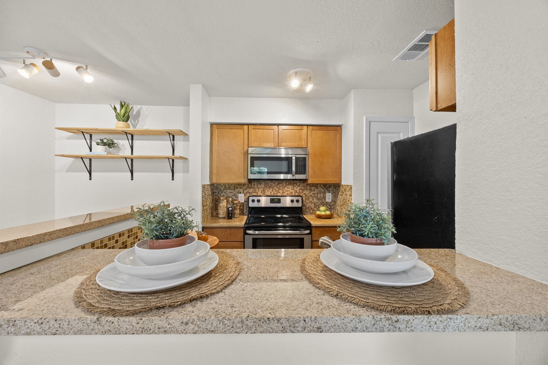 Top-Floor Condo Retreat in Gated Ivy Condos | Private Balcony + Tree-Filled Views