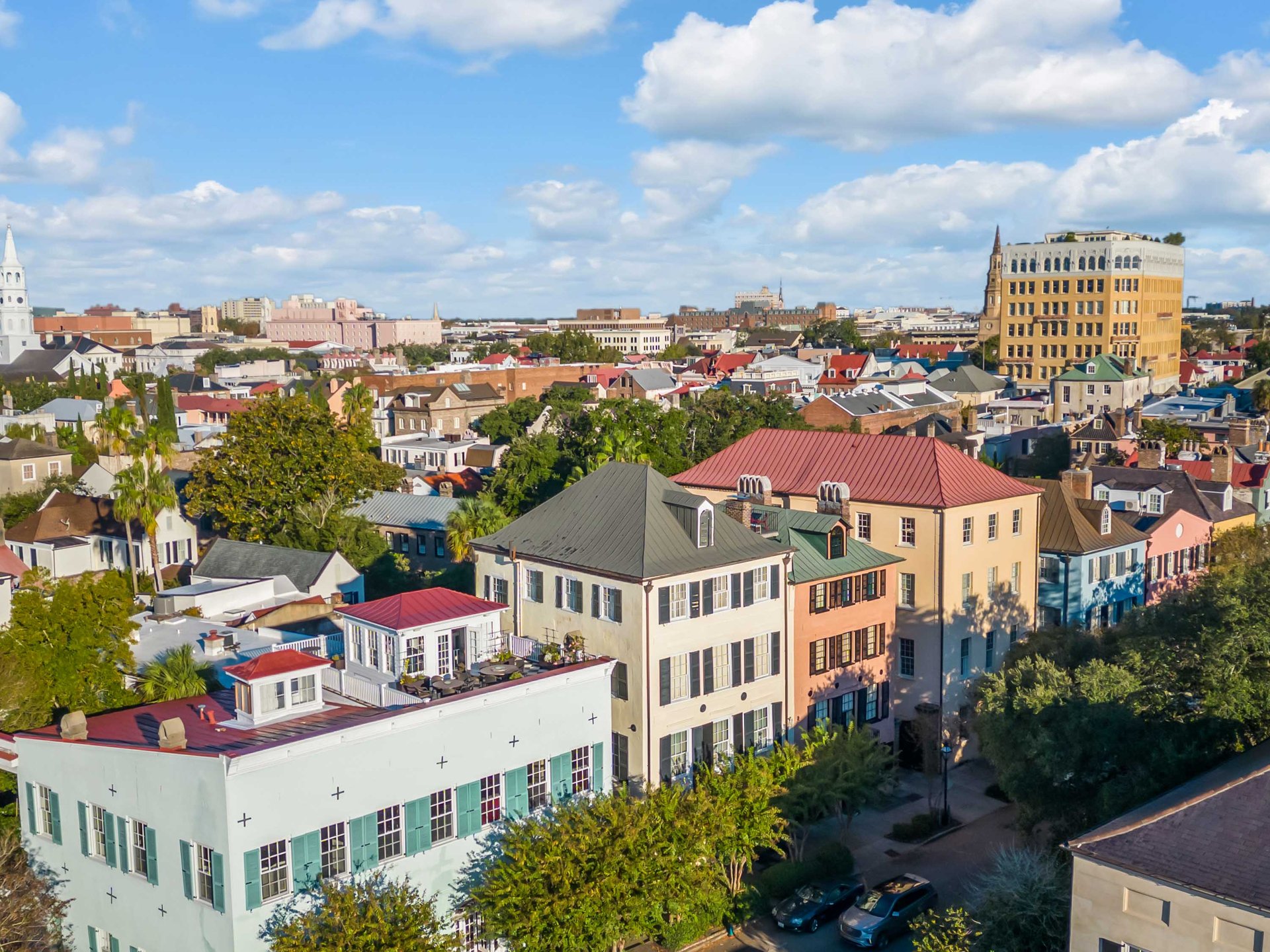 Aerial view of historic Charleston rooftops and church steeples