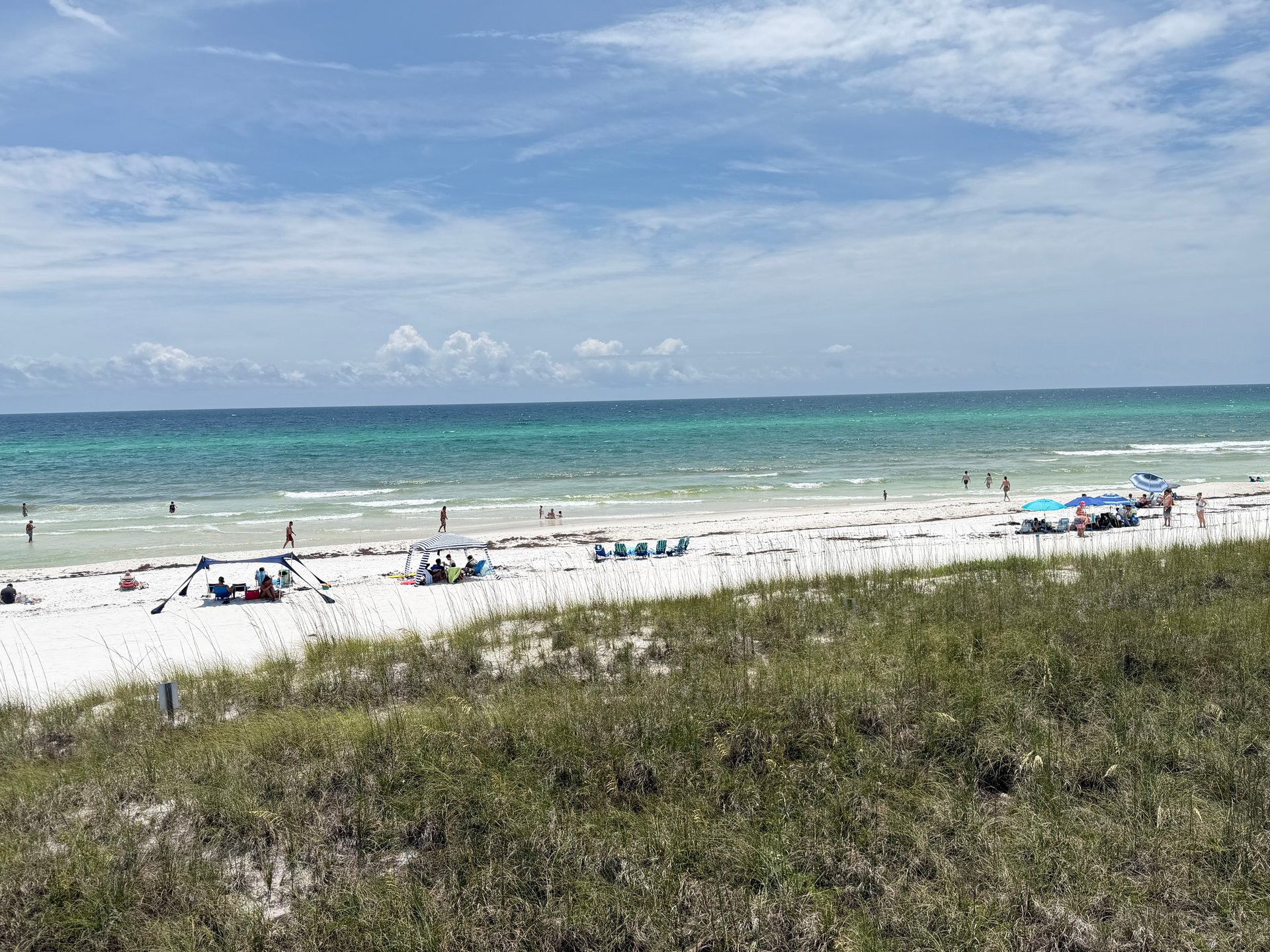 Emerald Gulf water and white sand beach near Boardwalk Beach Resort in Panama City Beach