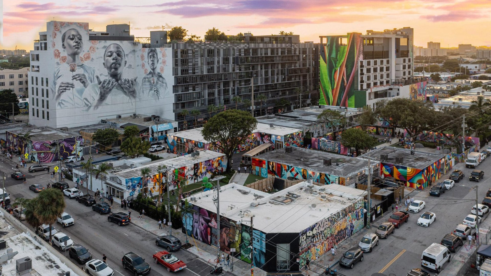 Aerial view of Wynwood Miami arts district with colorful street art murals and buildings during III Points Music Festival at sunset