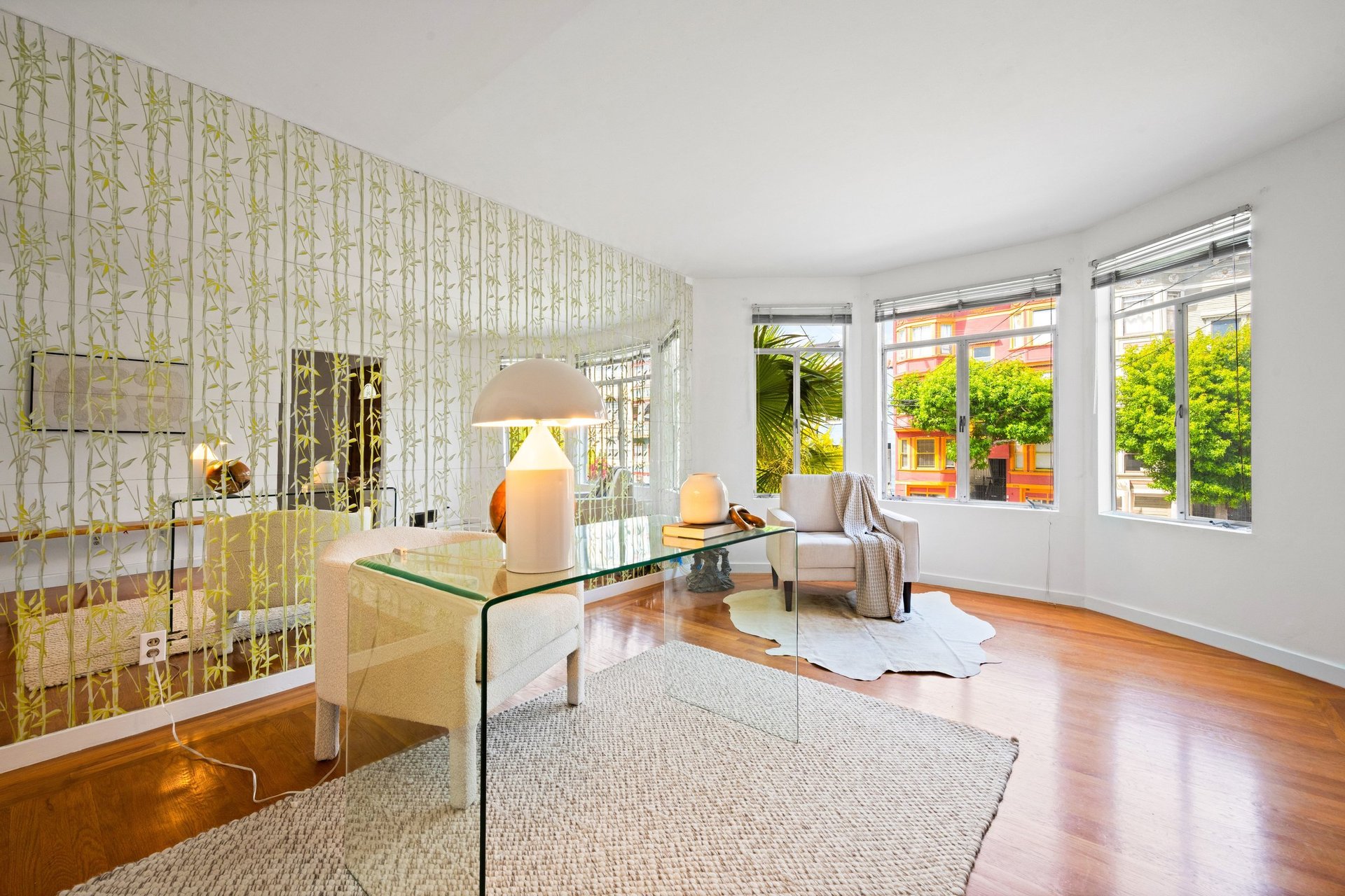 Light-filled living room with bay windows and hardwood floors at 2269 Bryant Street, Mission District San Francisco