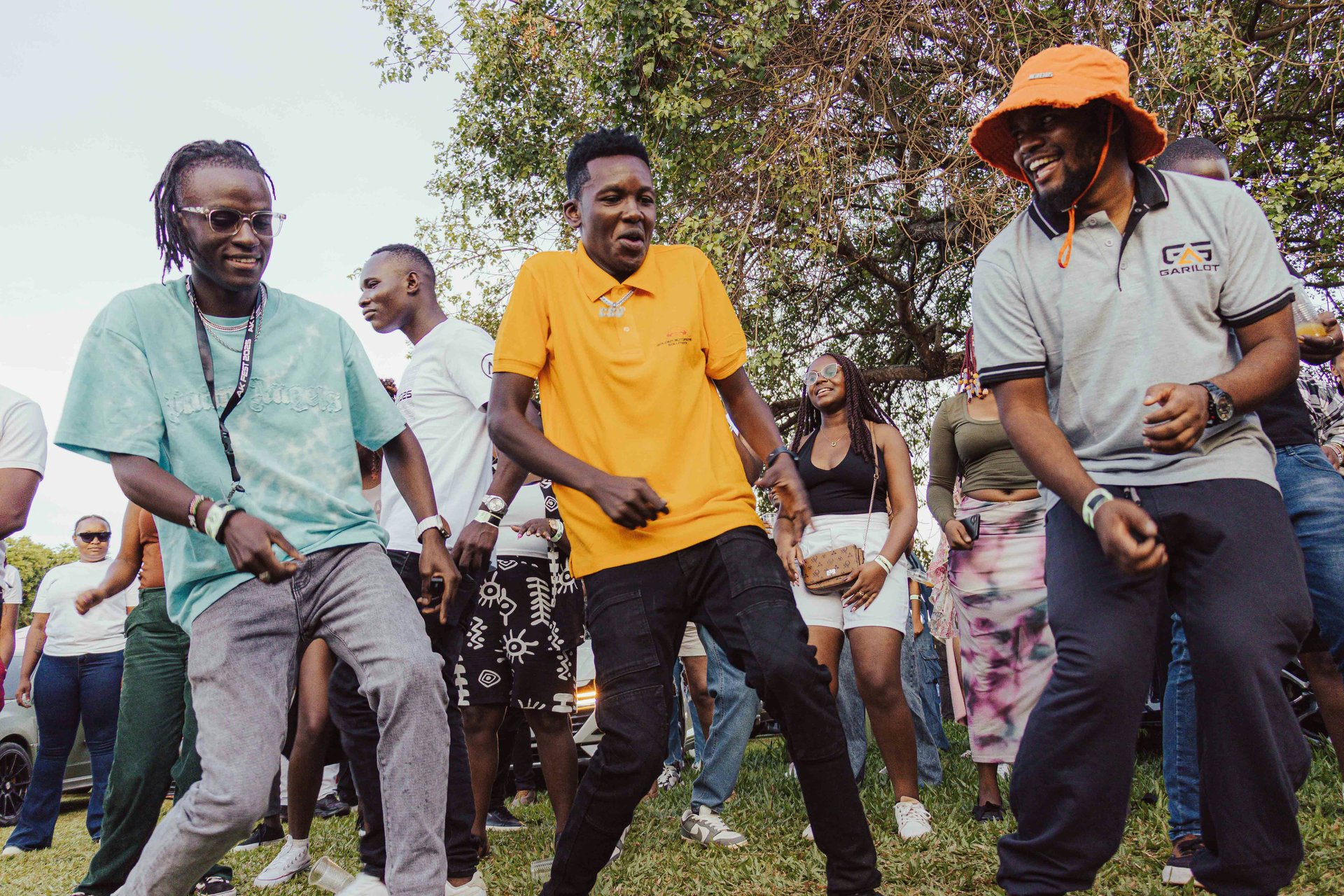  People dancing at an outdoor gathering