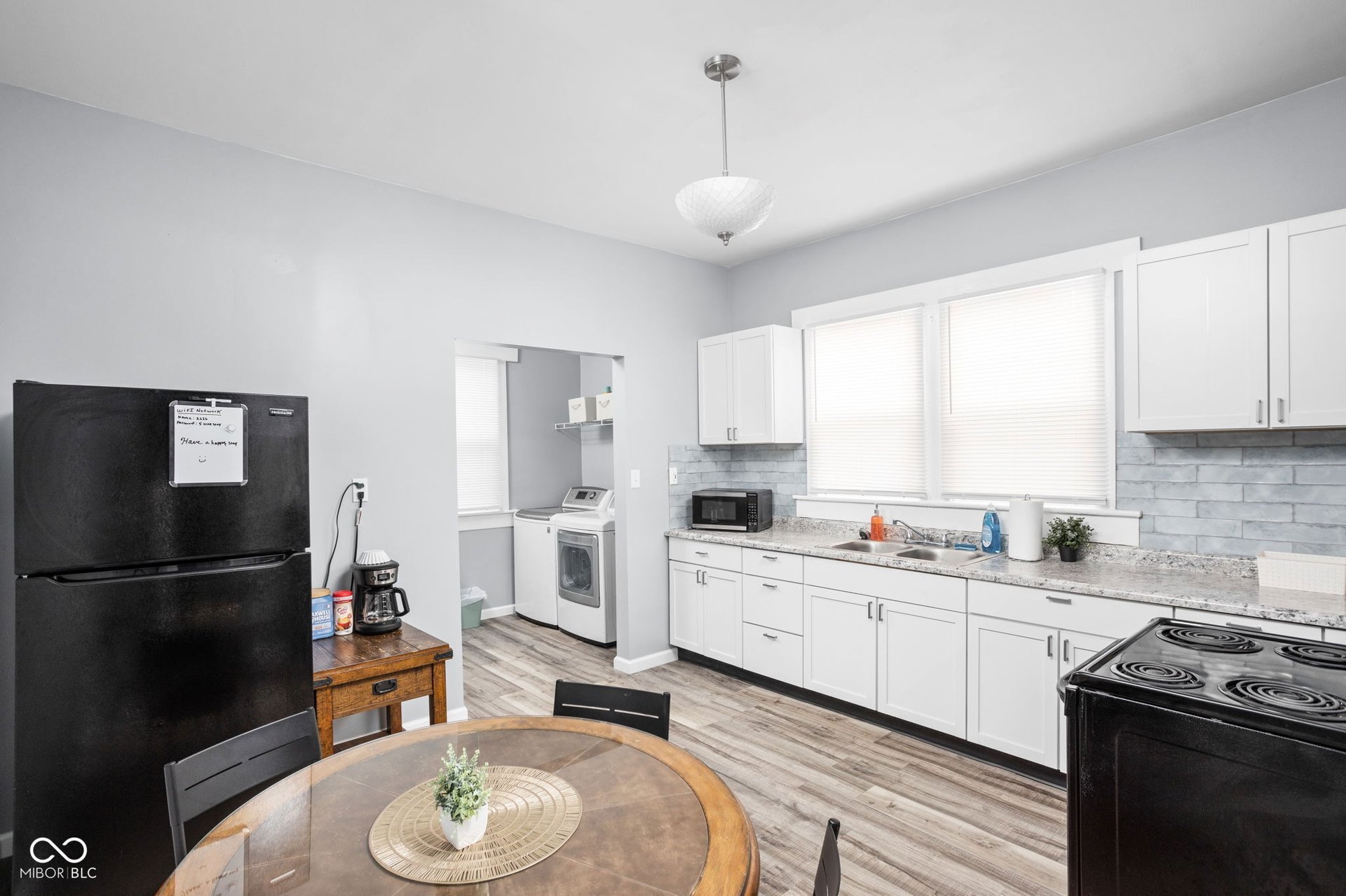 Bright updated kitchen in Indianapolis near-east side duplex at 2626 E Michigan St &ndash; granite counters, stainless appliances, cozy and functional space for owner-occupied living near Fountain Square