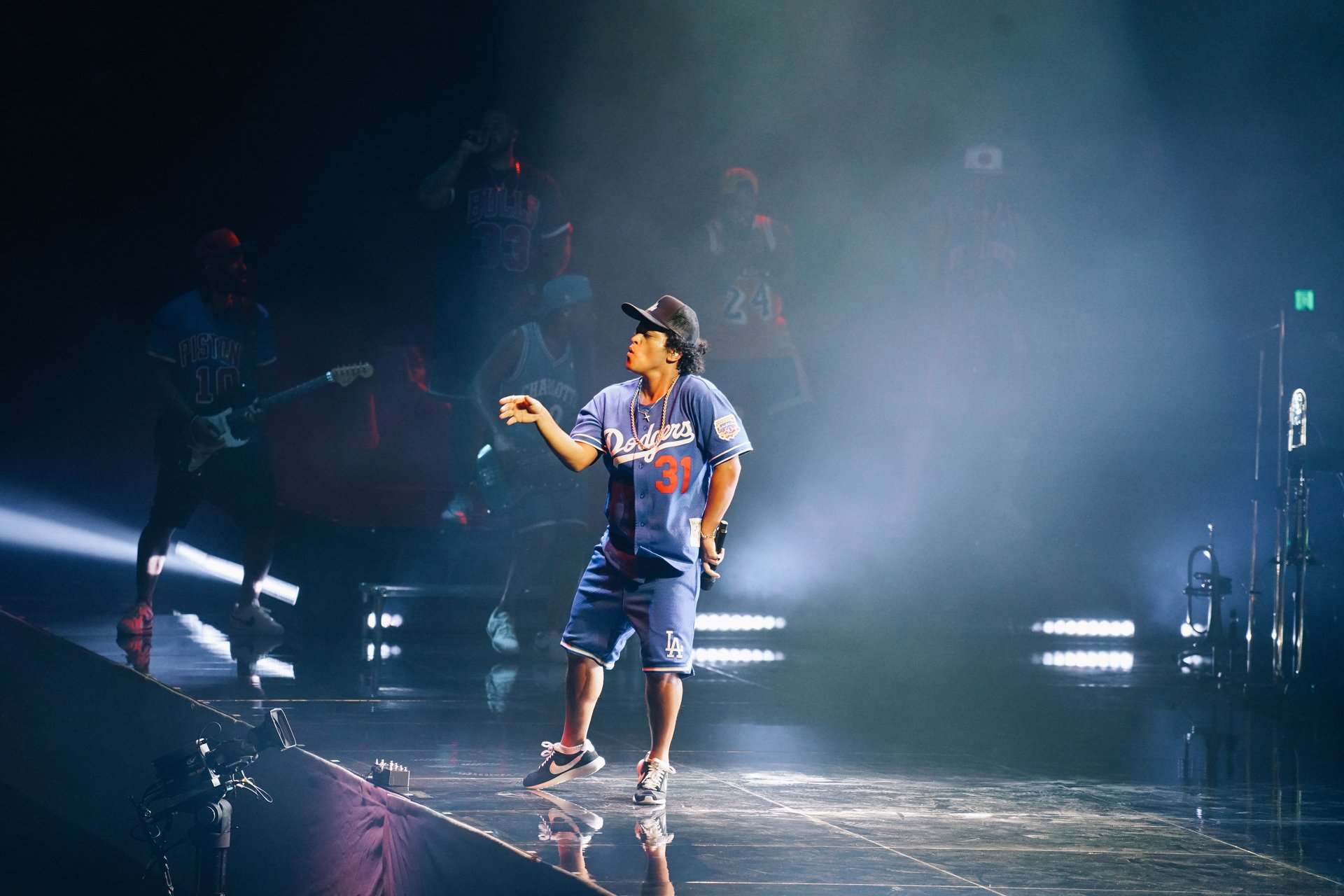 Bruno Mars performing live under stage lights