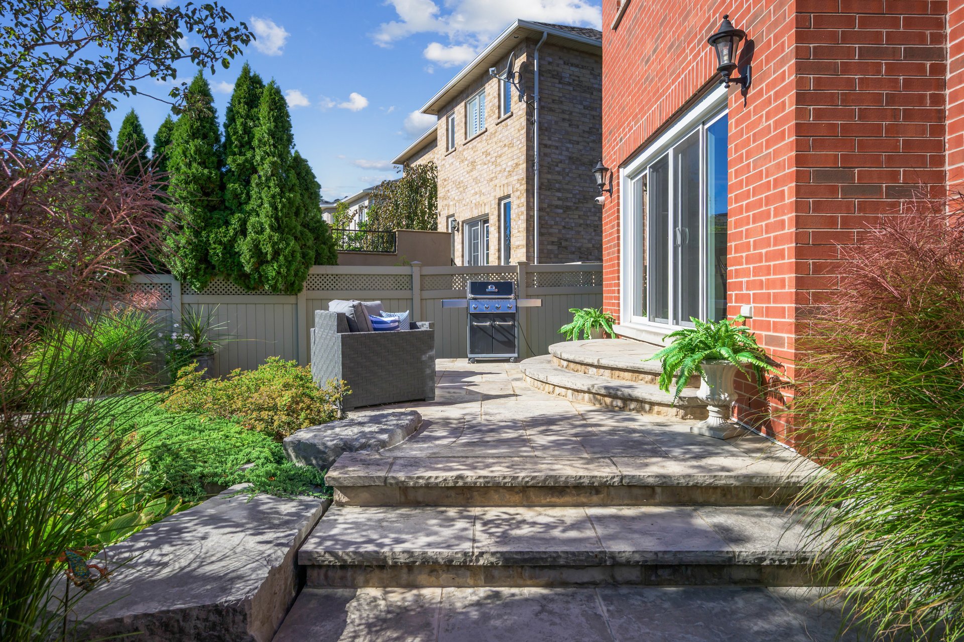 Resort-style yard backing onto lush ravine