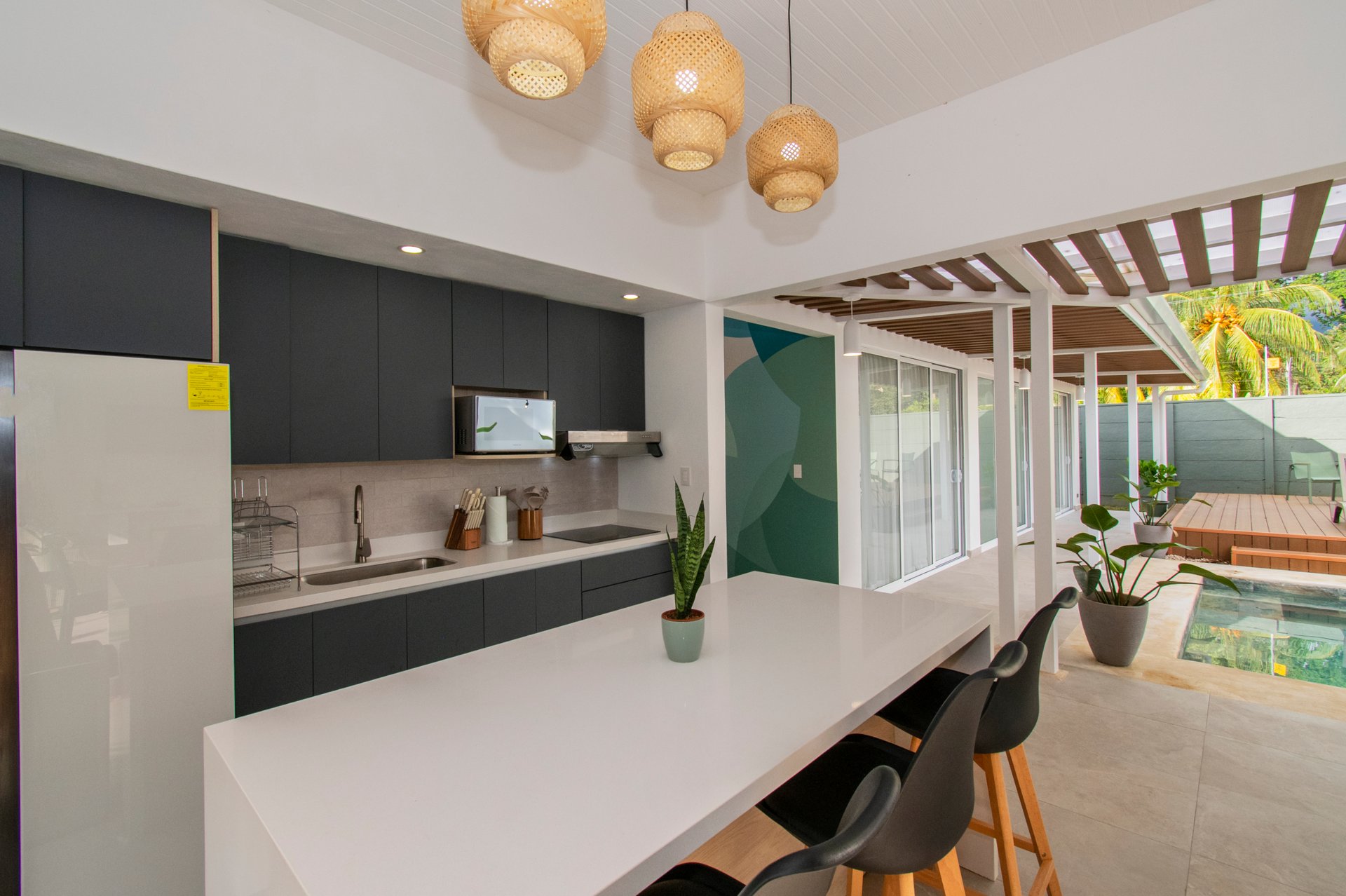 Turnkey Tropical Home Steps from the Beach