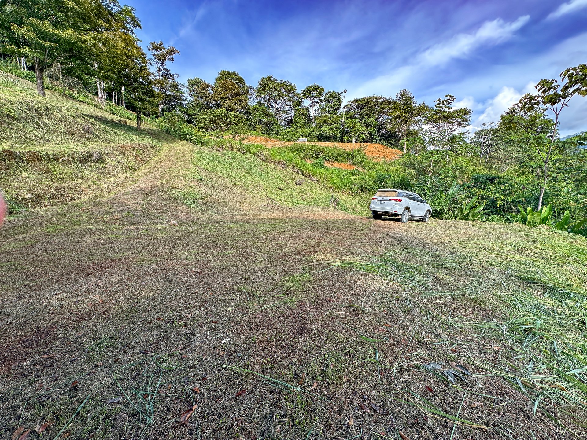 Jungle, Mountain & Valley View Lot with Two Large Plantels, Bordering a Crystal Mountain River with Swimholes & a Waterfall